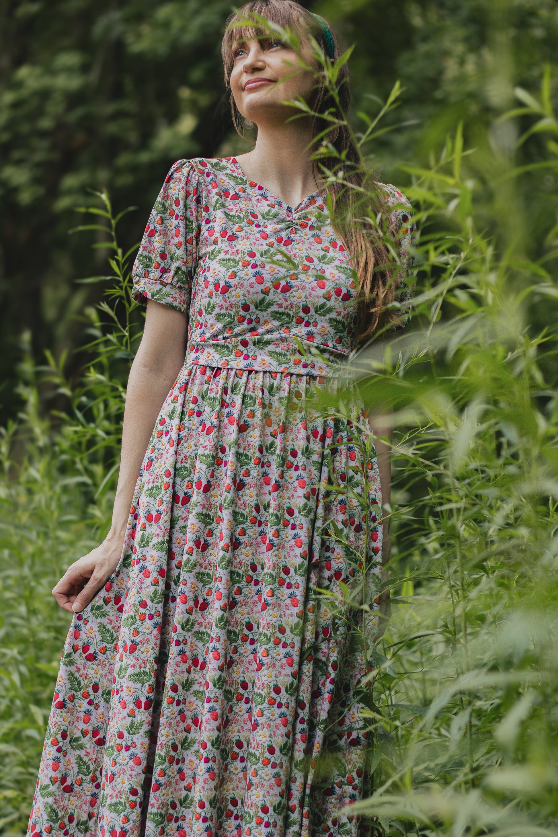 Woman in a floral modest nursing dress.