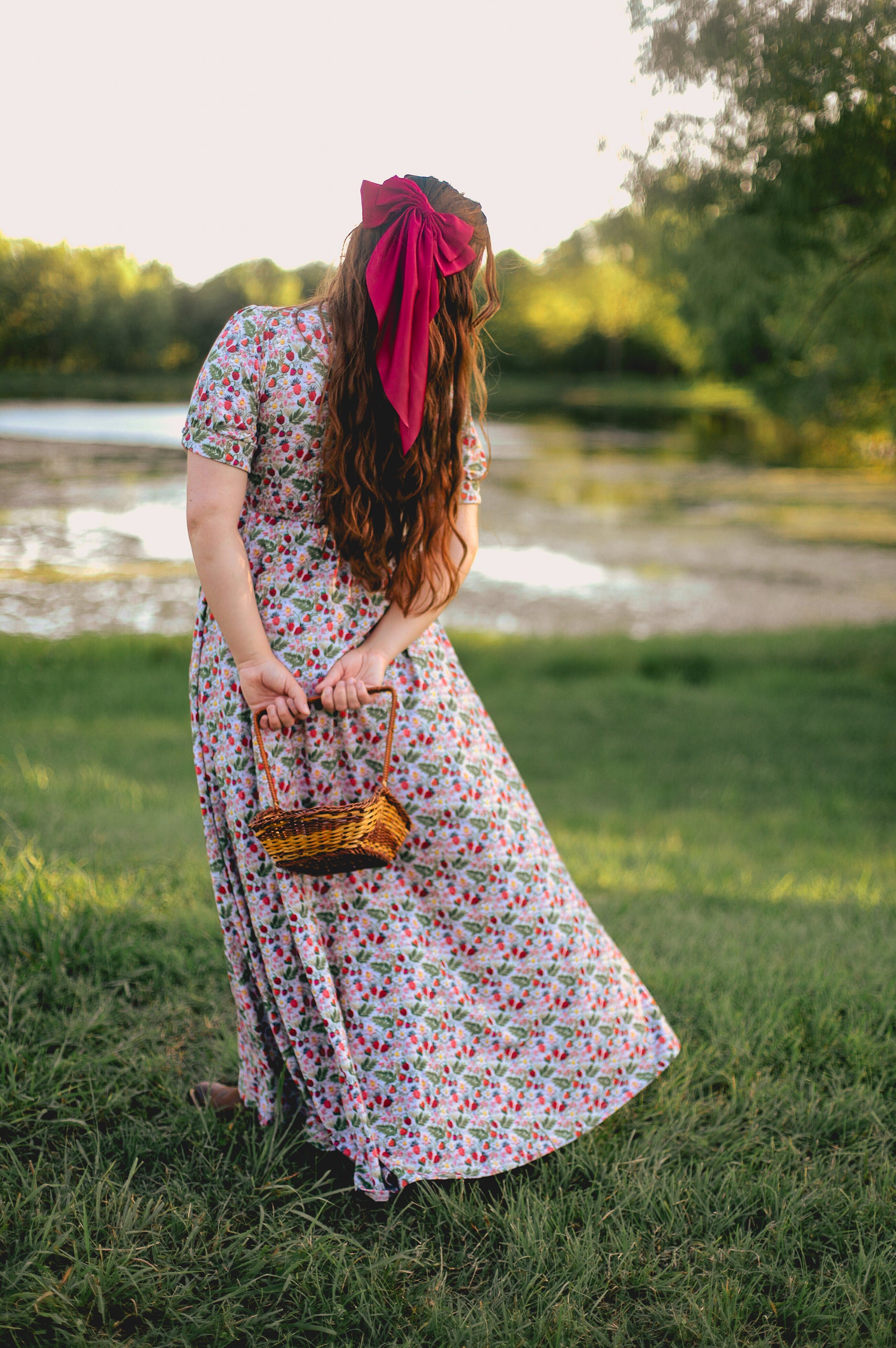 Woman in a floral modest nursing dress.