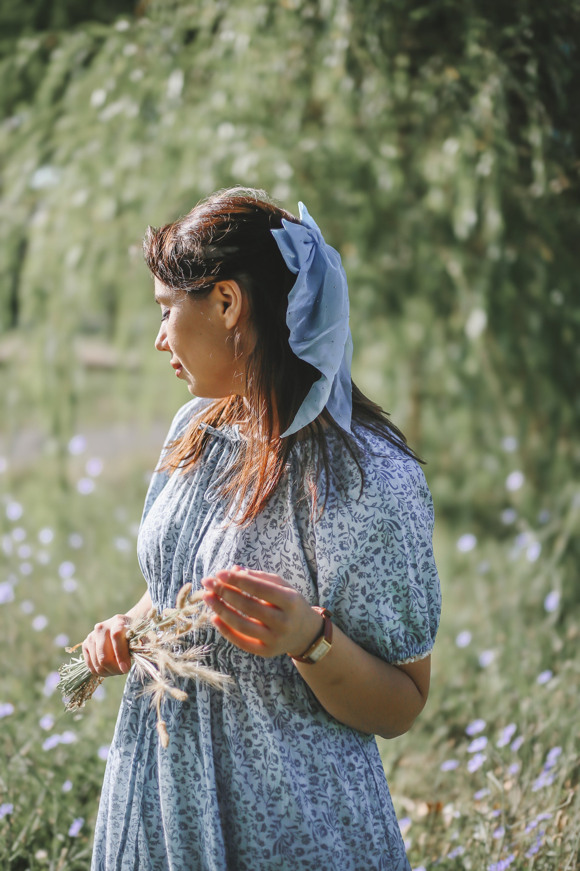 woman in a modest blue nursing dress