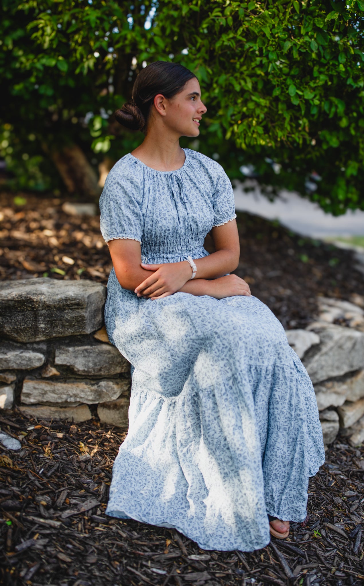 woman in a modest blue nursing dress