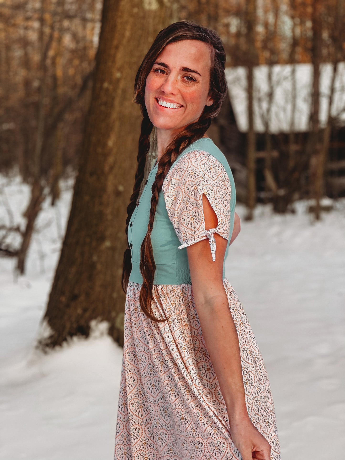 A woman wearing a vintage style modest nursing dress.