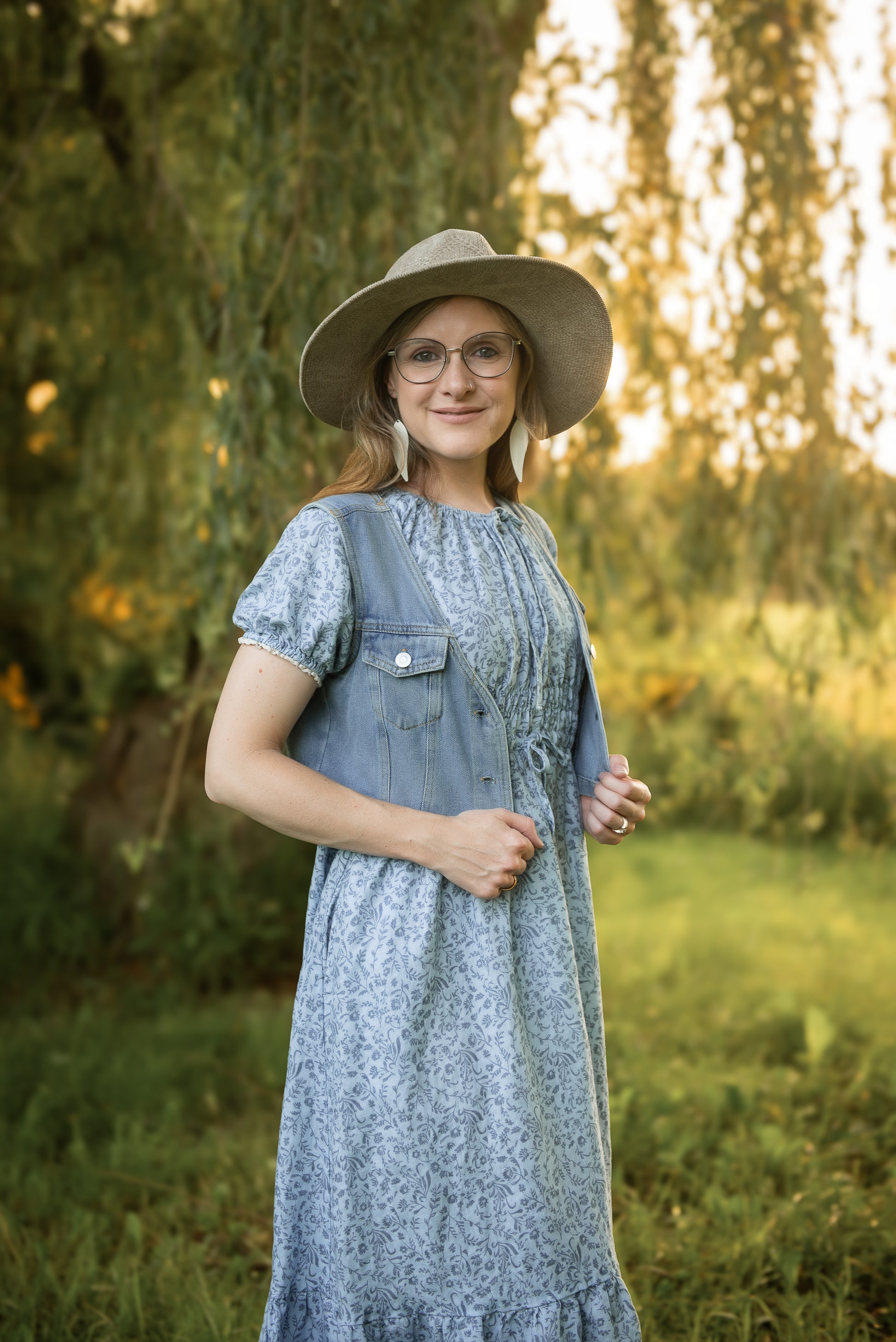 woman in a modest blue nursing dress