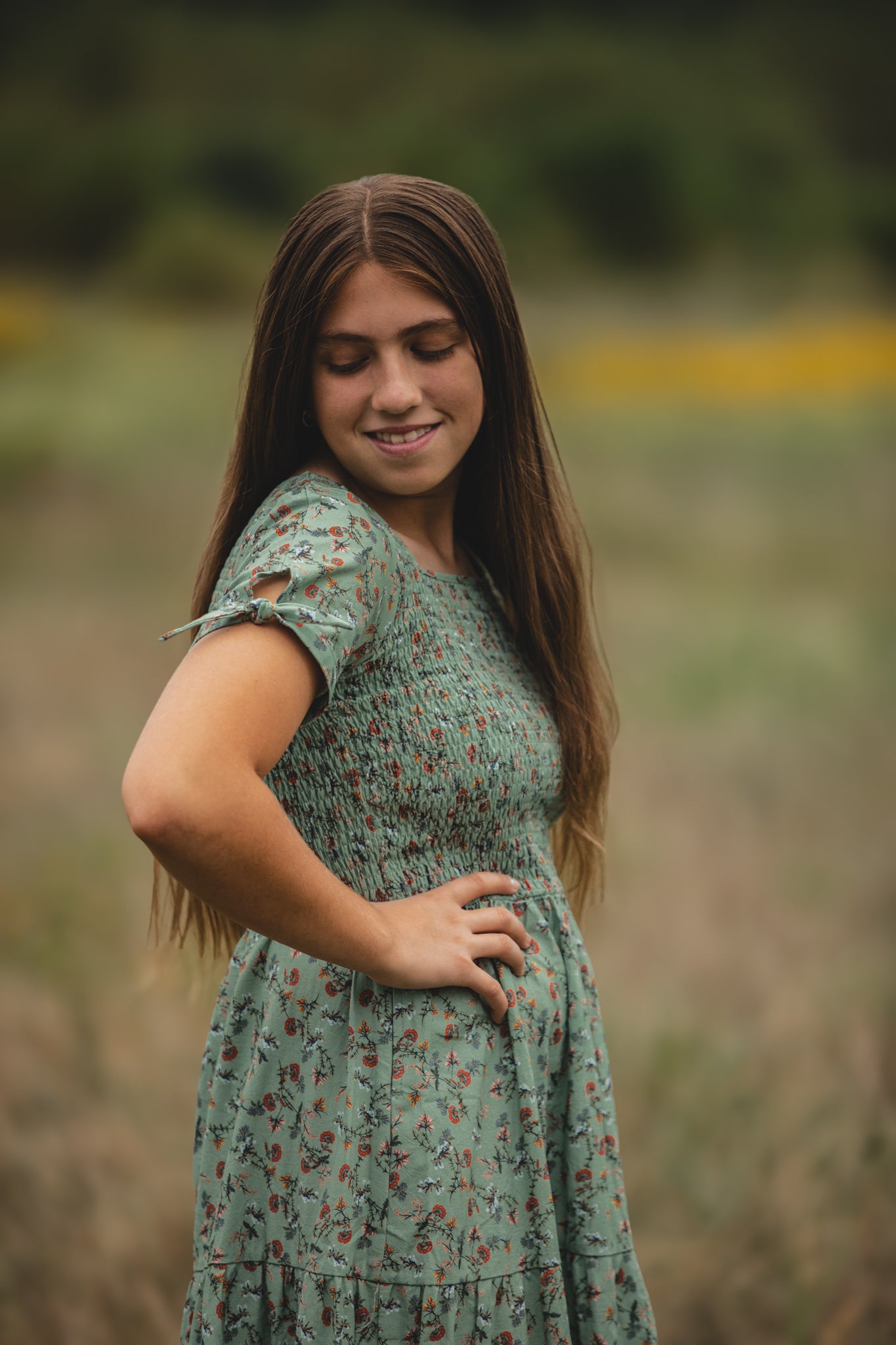 woman wearing a modest nursing green floral dress