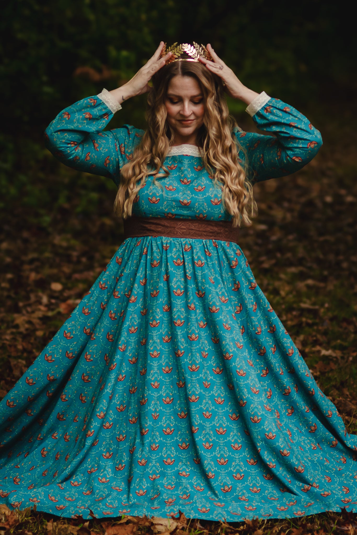 Woman in modest nursing teal dress in forest