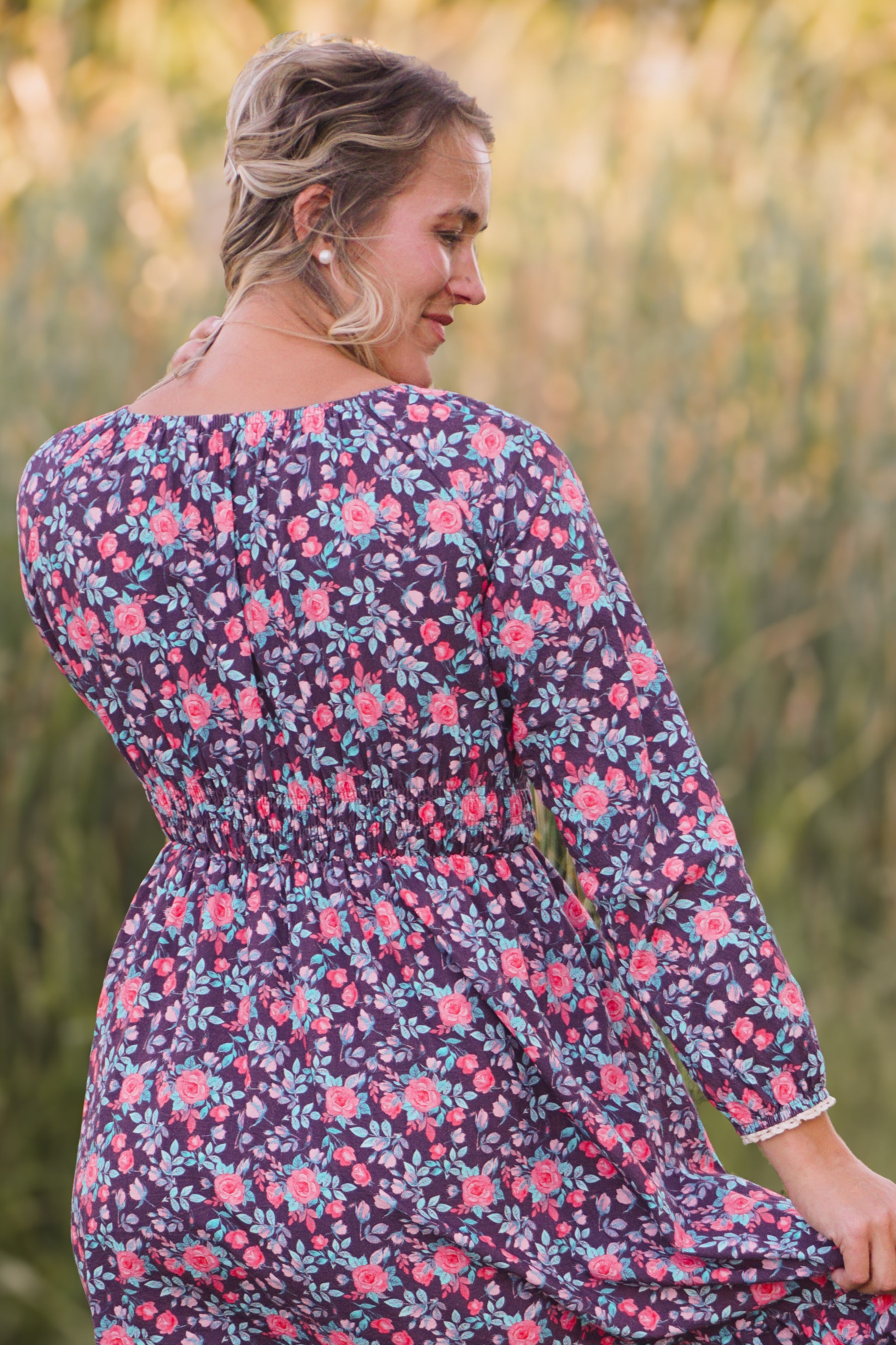 Woman in modest nursing floral dress outdoors