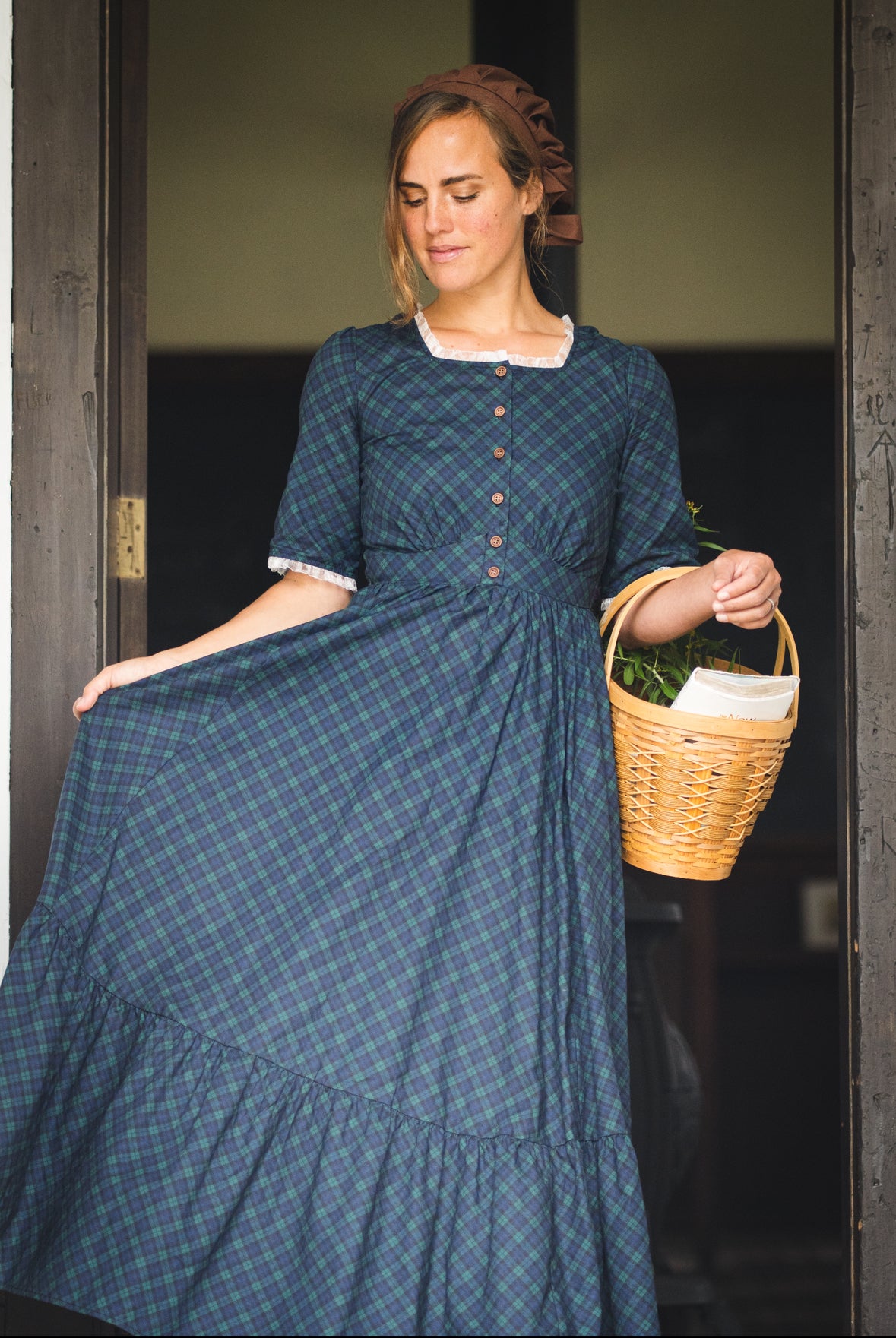 woman wearing a modest nursing blue patterned dress