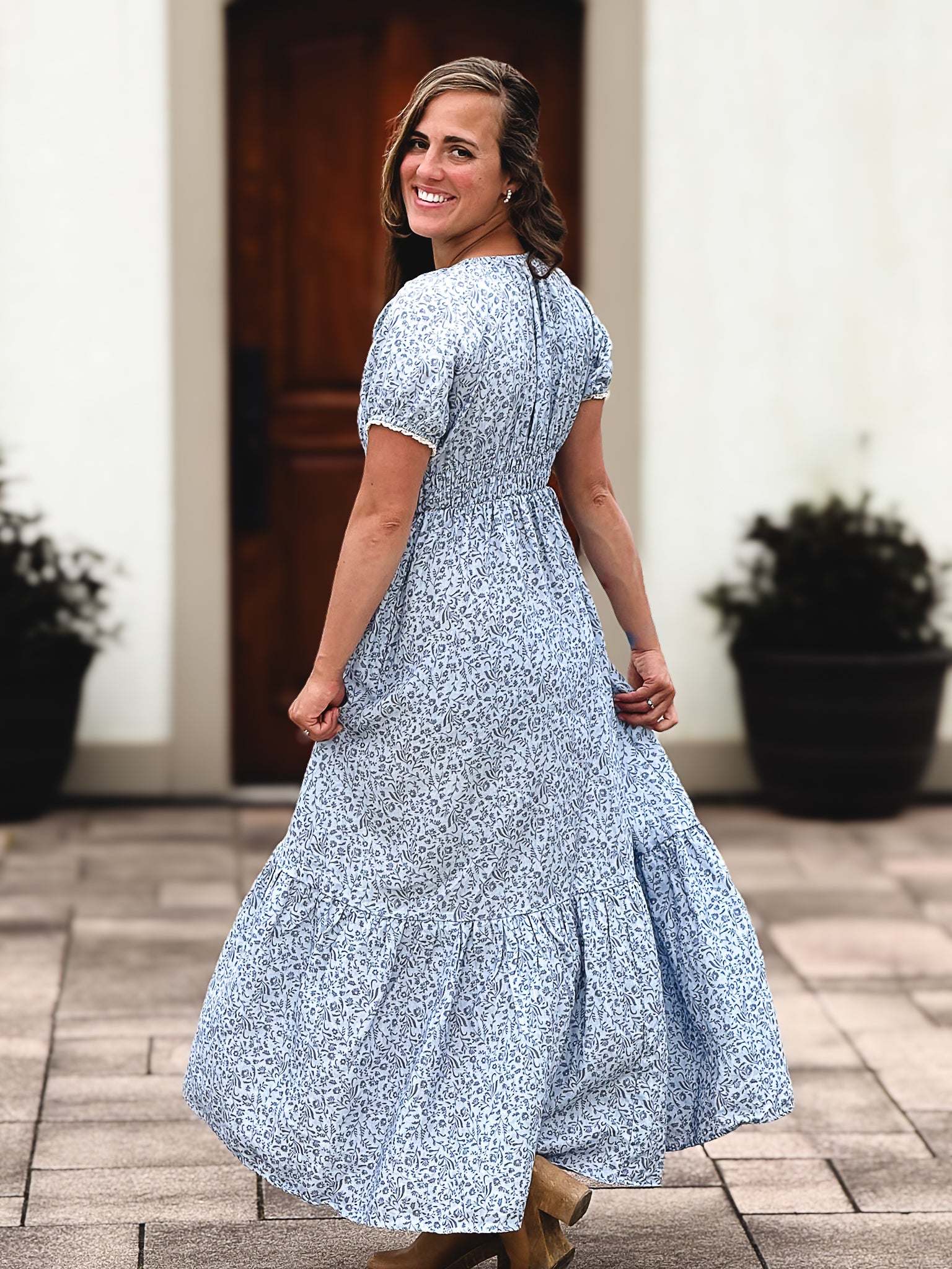 woman in a modest blue nursing dress