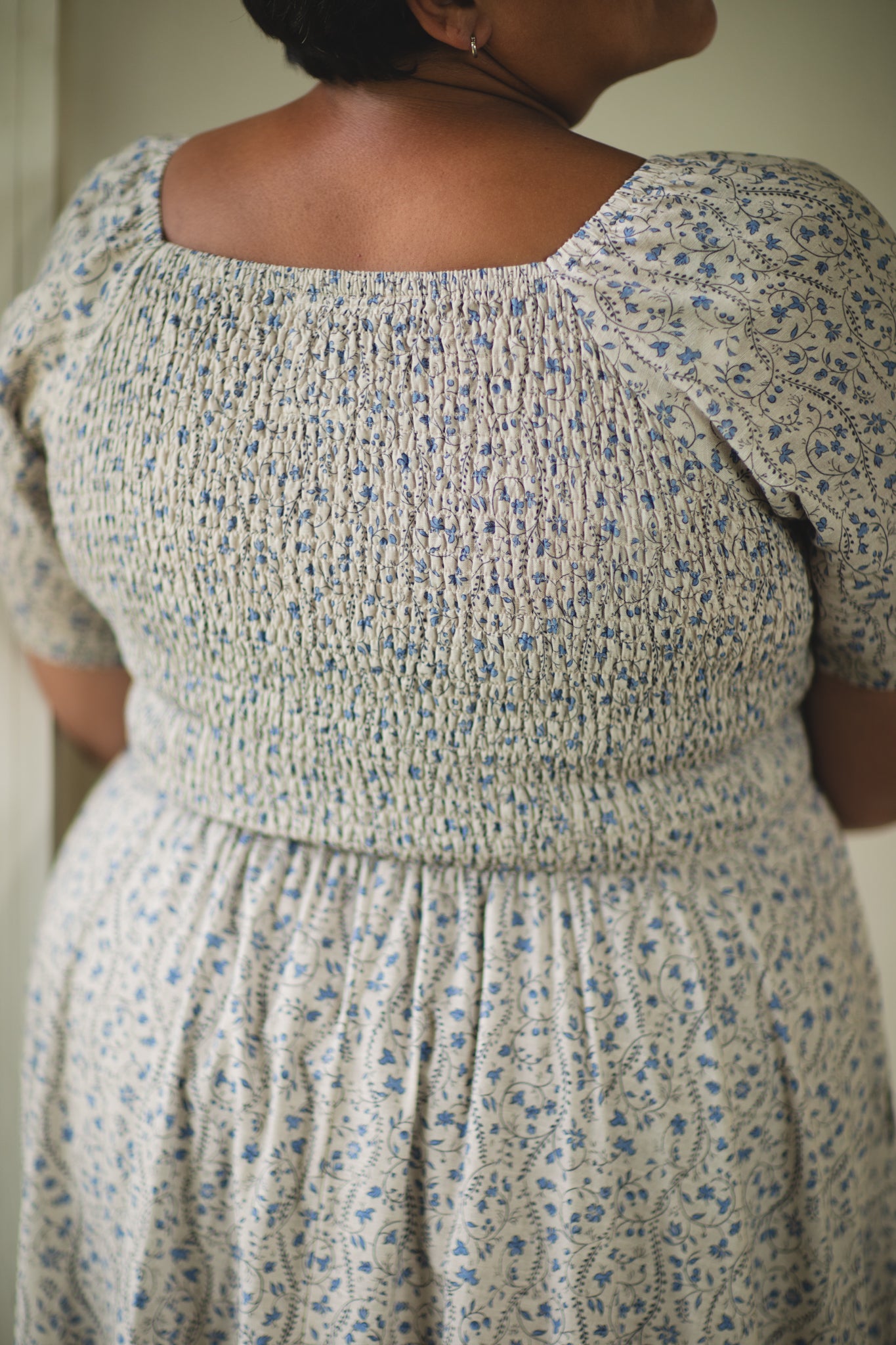 woman in patterned modest nursing dress