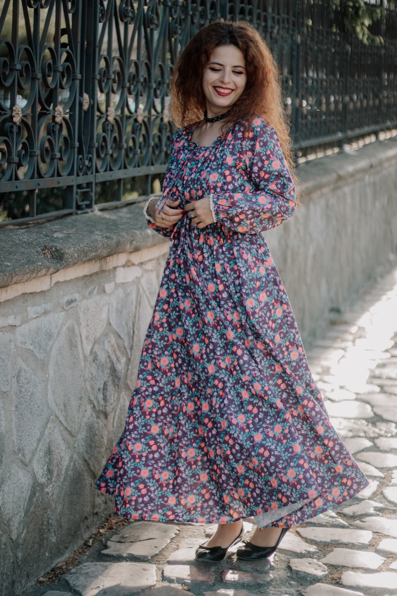 Woman in modest nursing dress on stone path
