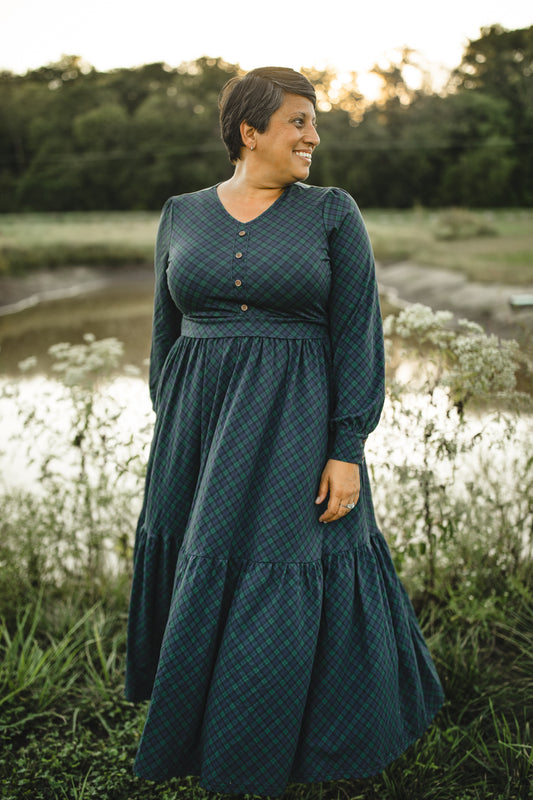 Woman in modest nursing teal dress outdoors