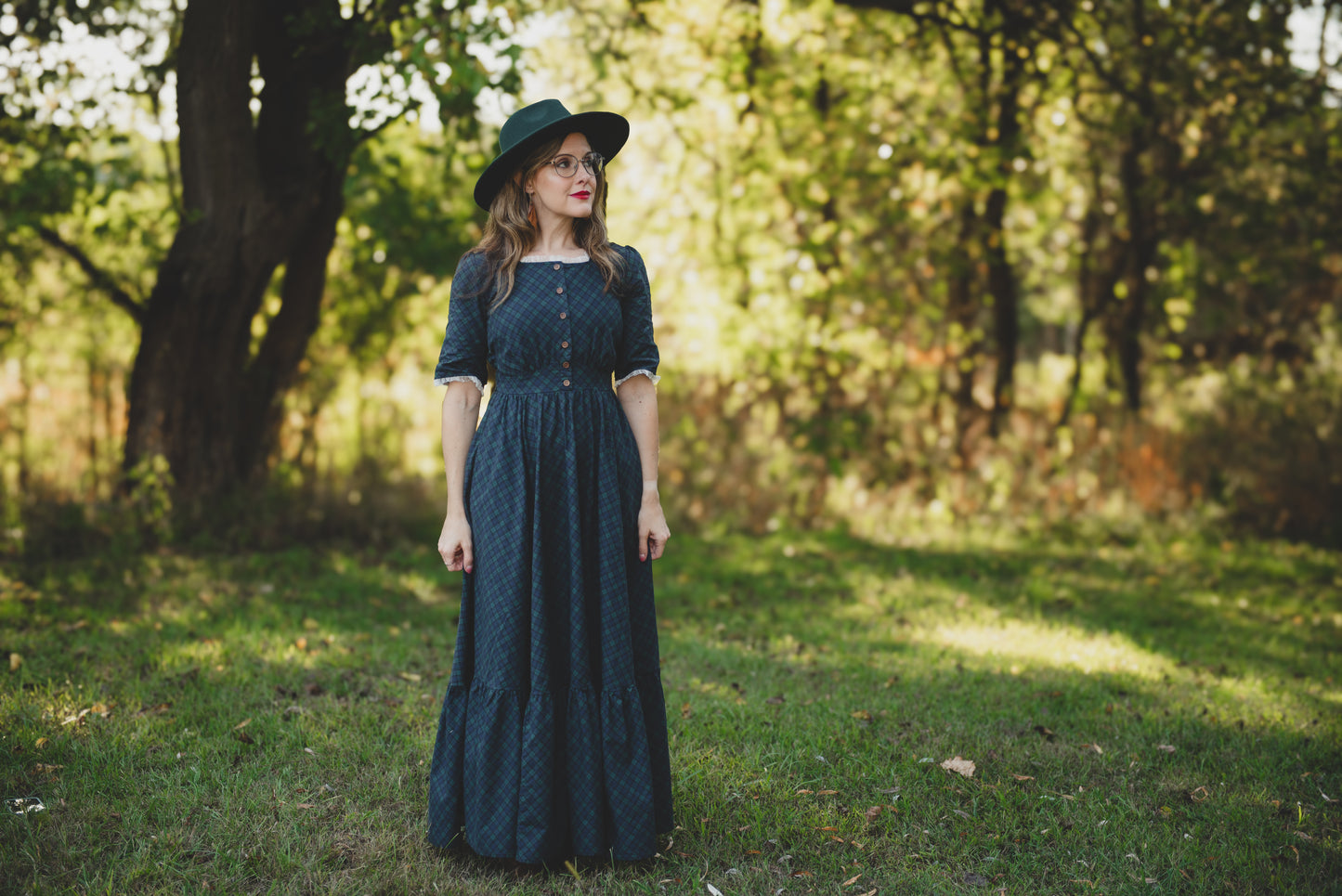 woman wearing a modest nursing blue patterned dress