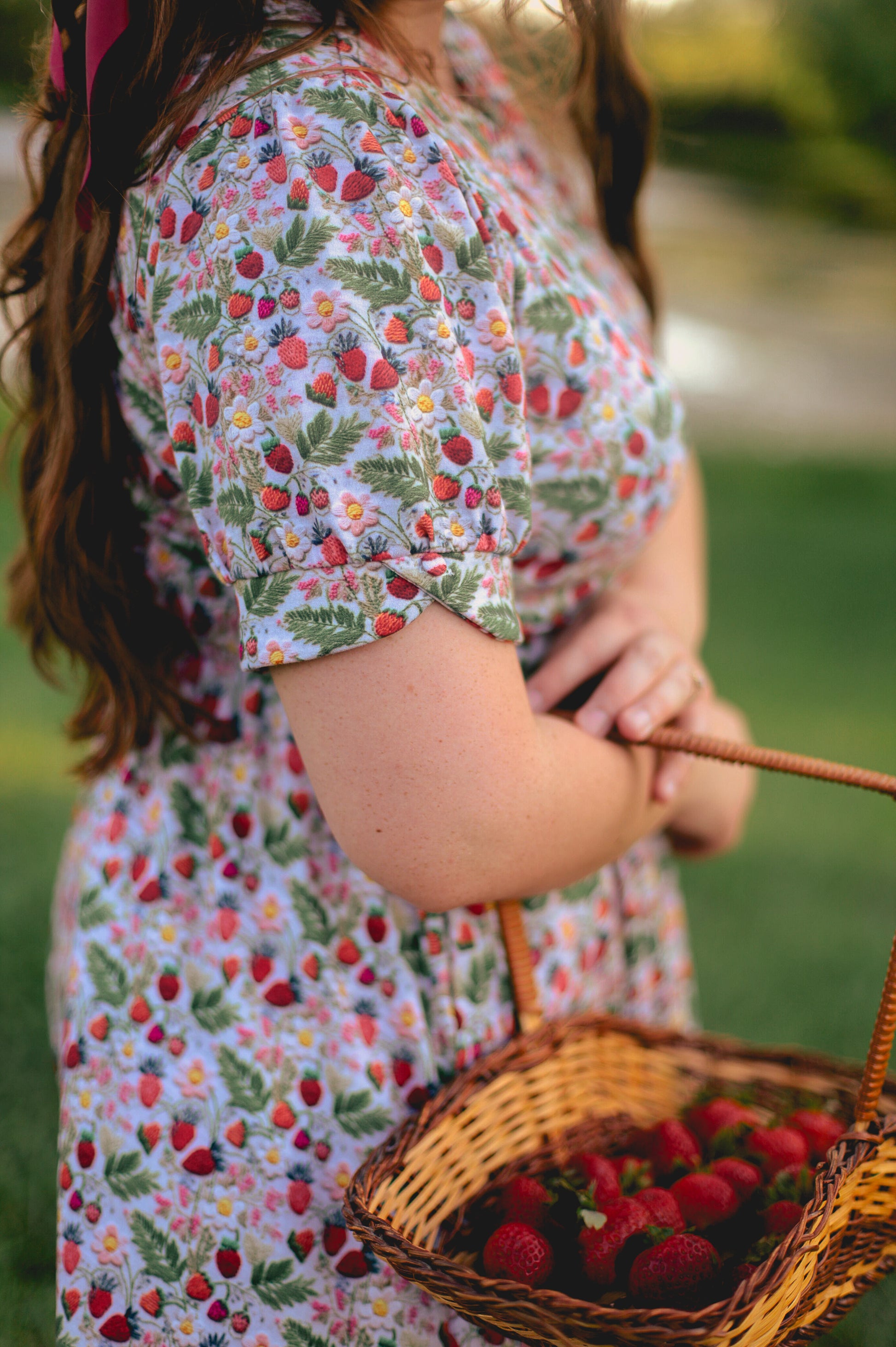 Woman in a floral modest nursing dress.