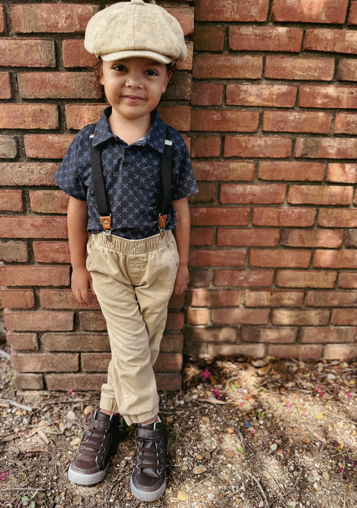 Young boy wearing a dark blue polo shirt