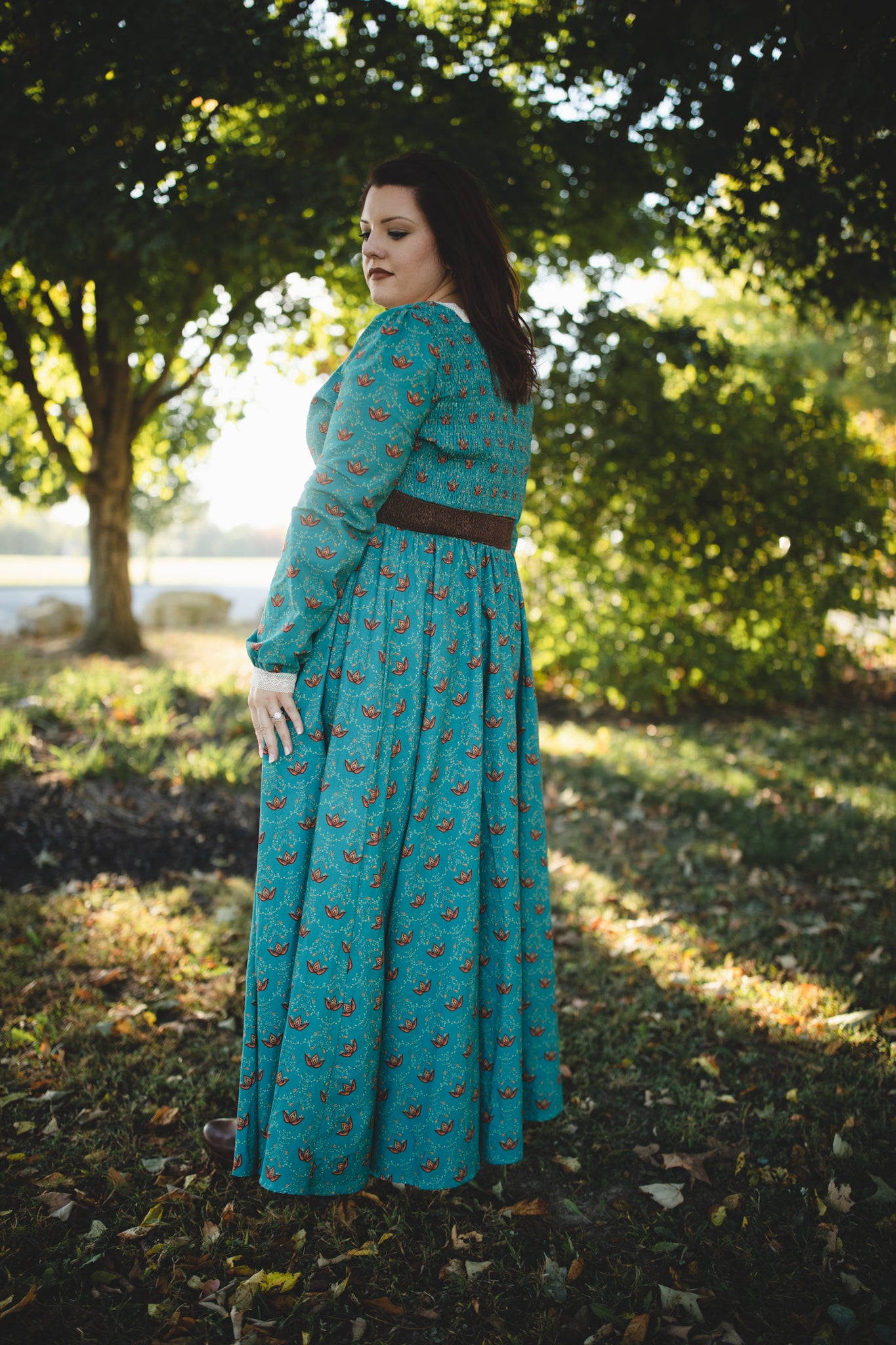 Woman in modest nursing teal dress outdoors