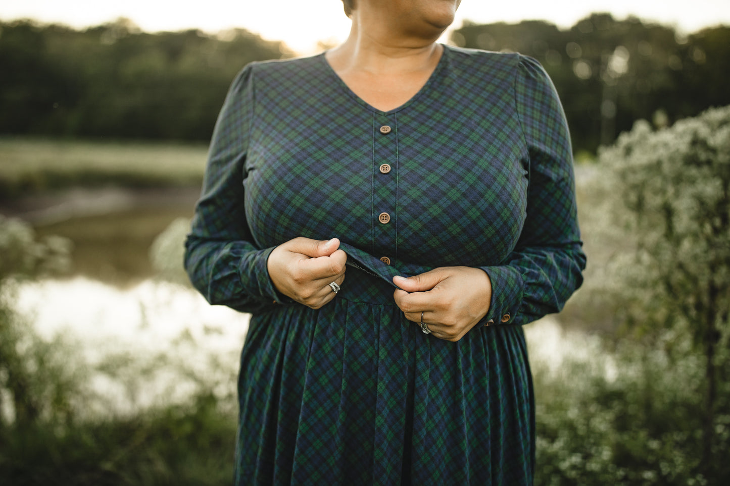 Woman in modest nursing green plaid dress outdoors