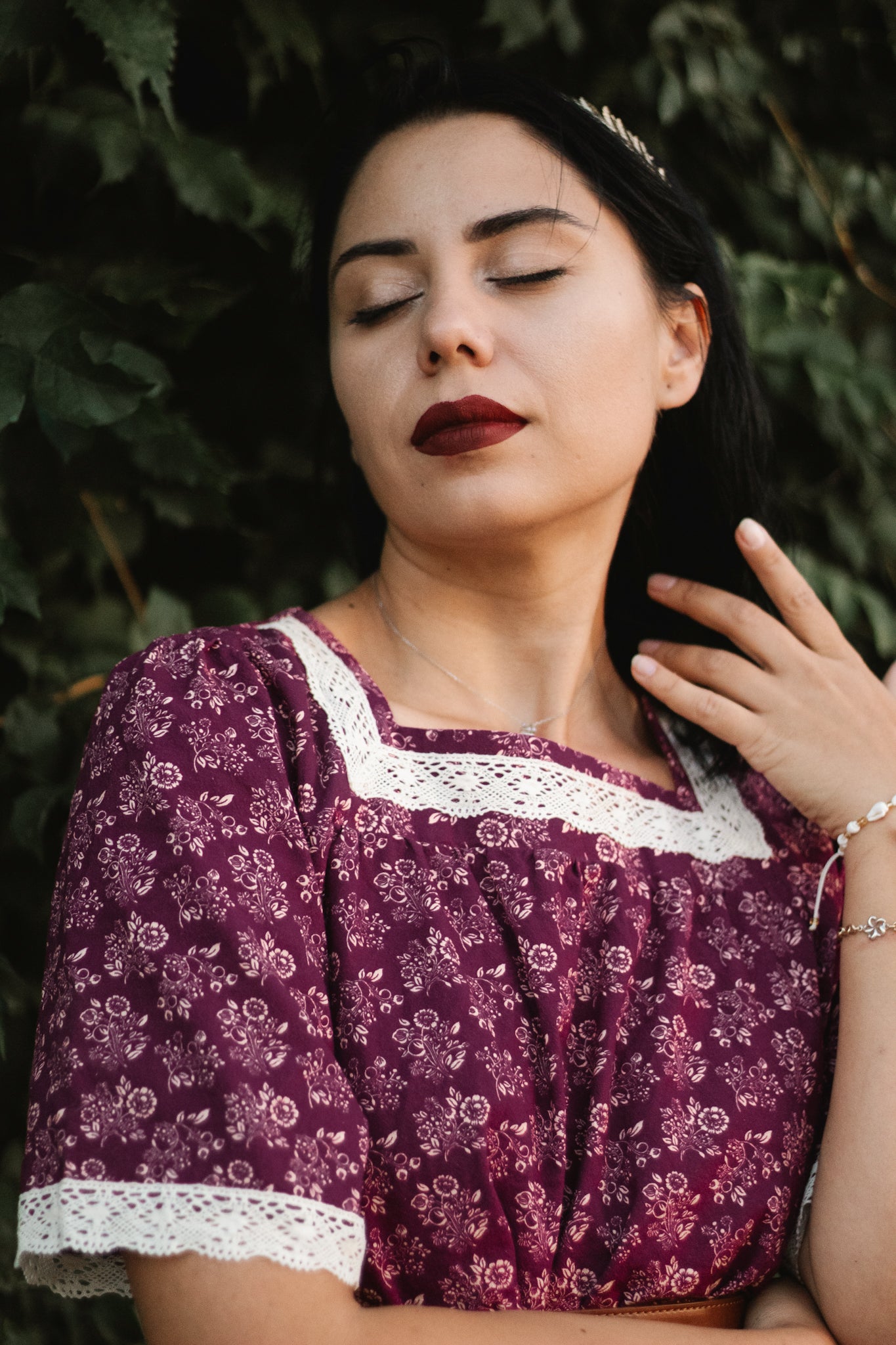 Woman in modest purple nursing dress with trim