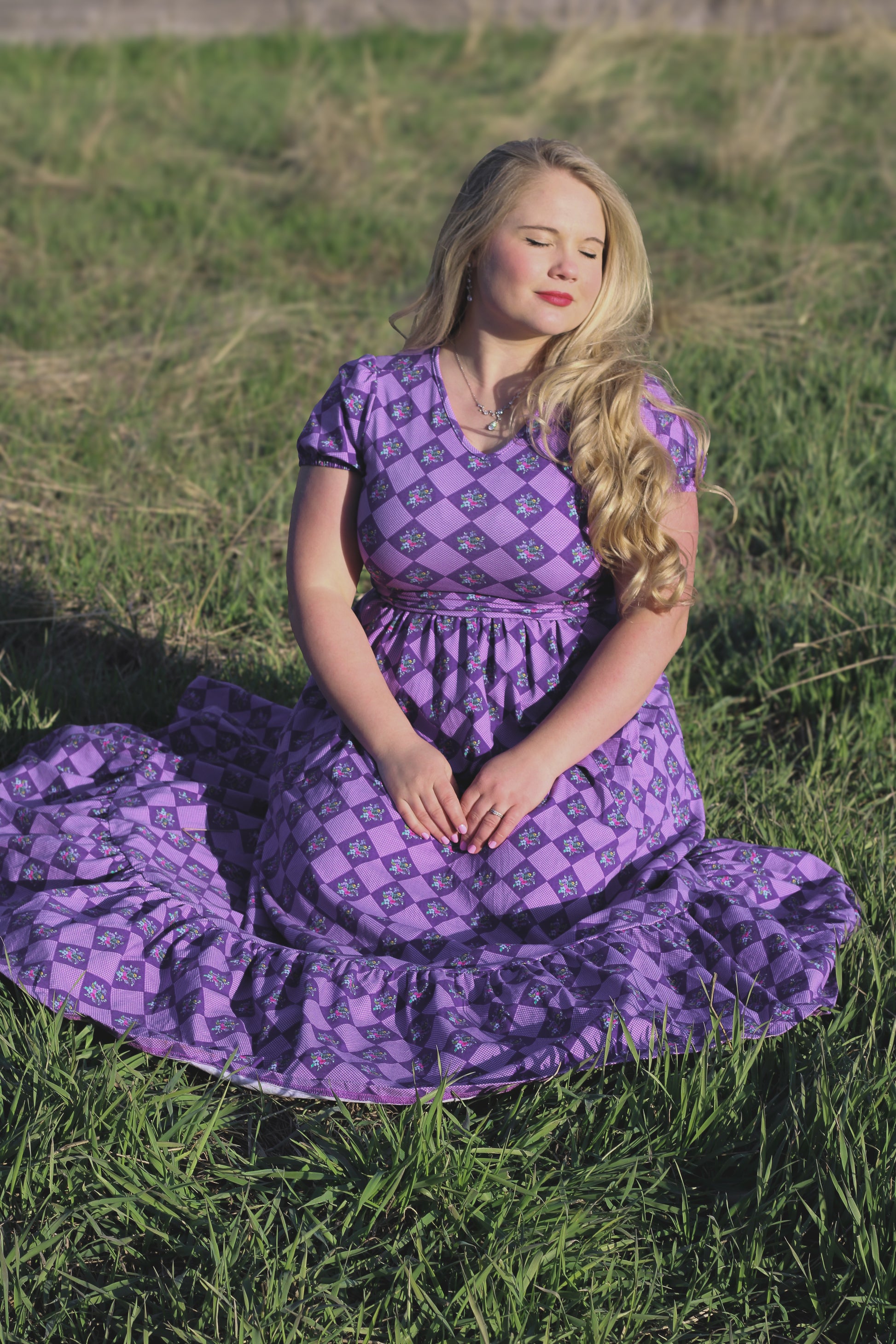 woman wearing a purple modest nursing dress