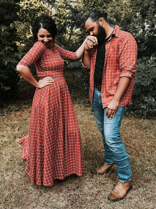 Woman in modest nursing copper windowpane maxi dress outdoors