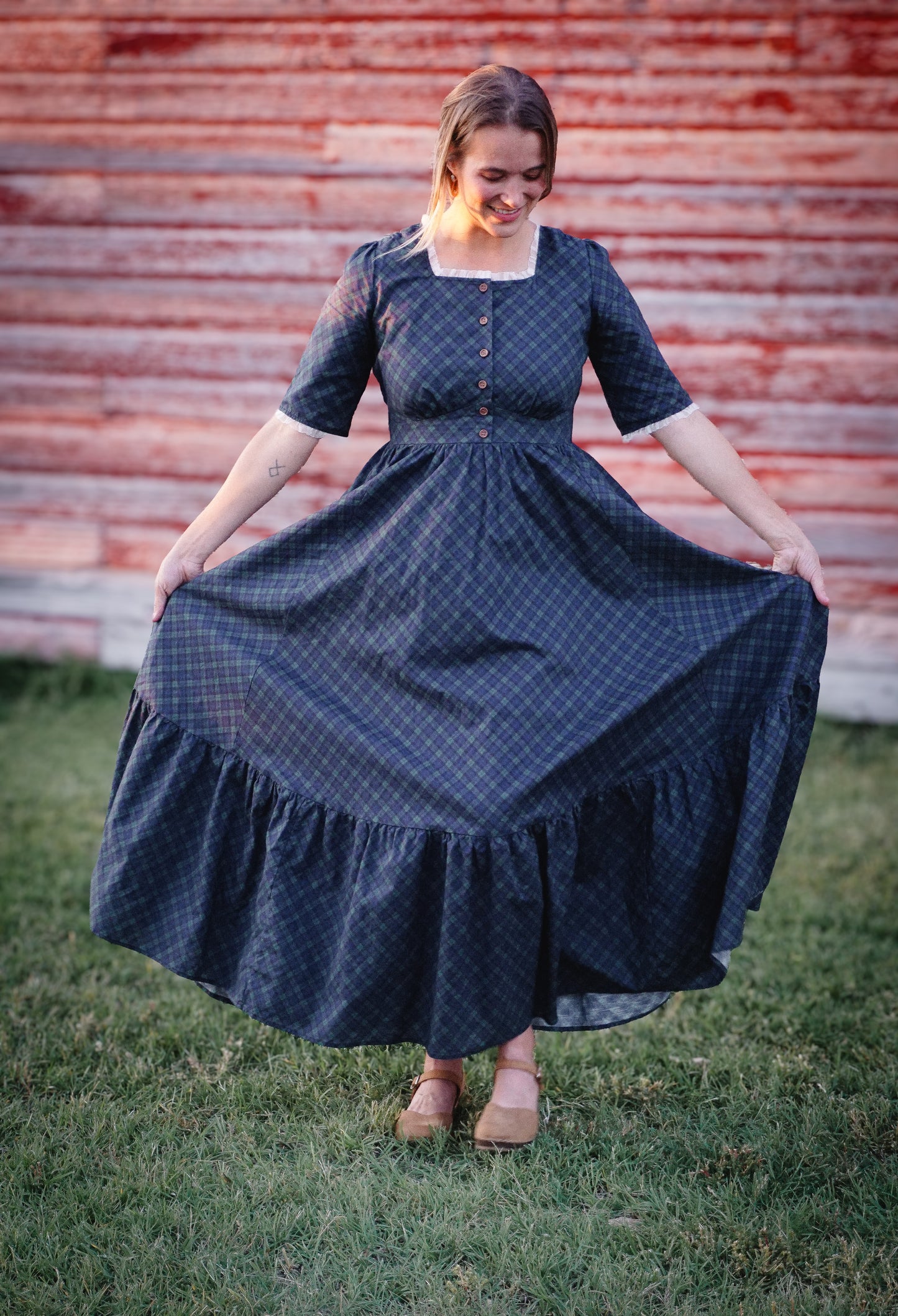 woman wearing a modest nursing blue patterned dress