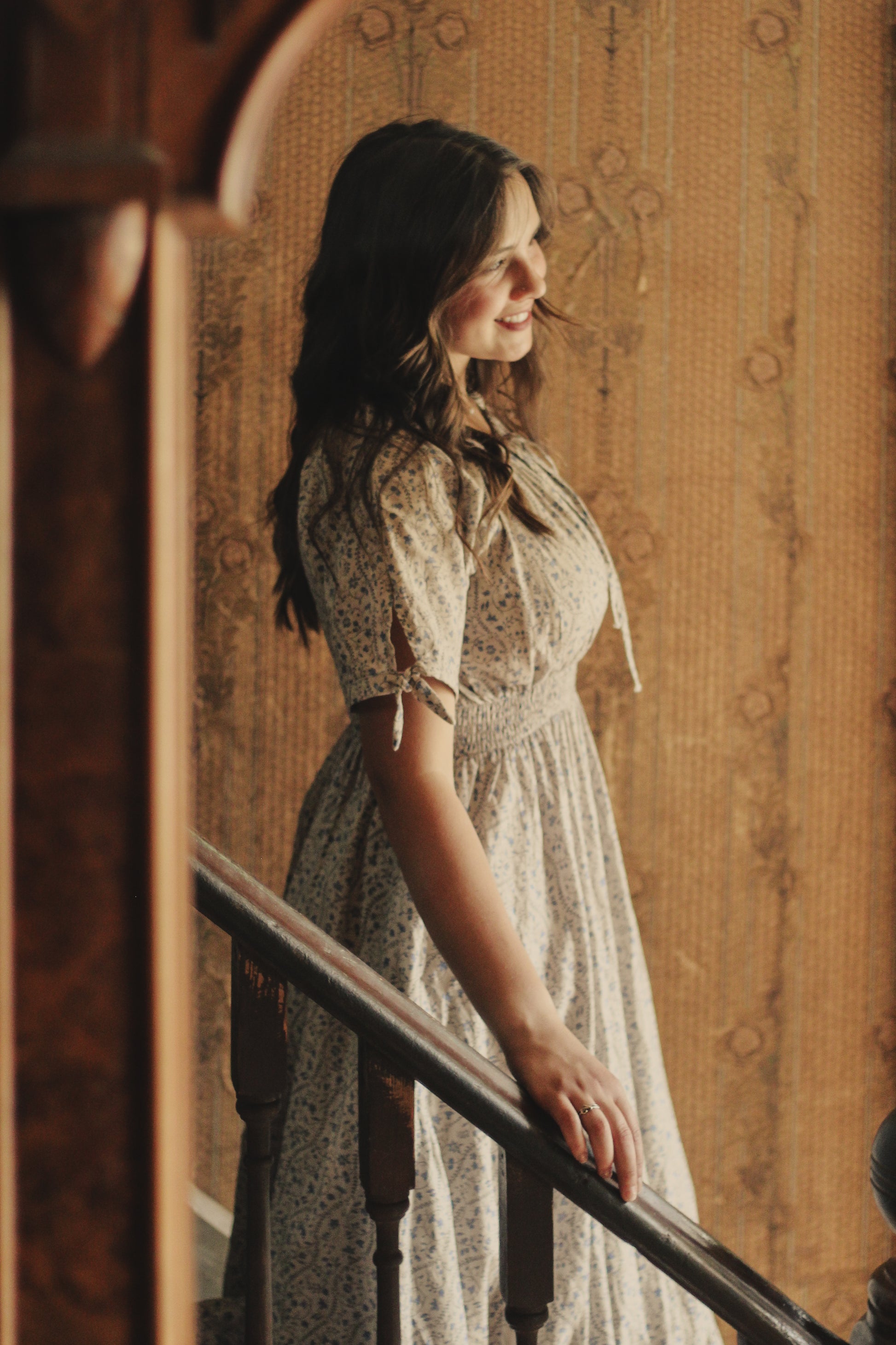 woman in patterned modest nursing dress