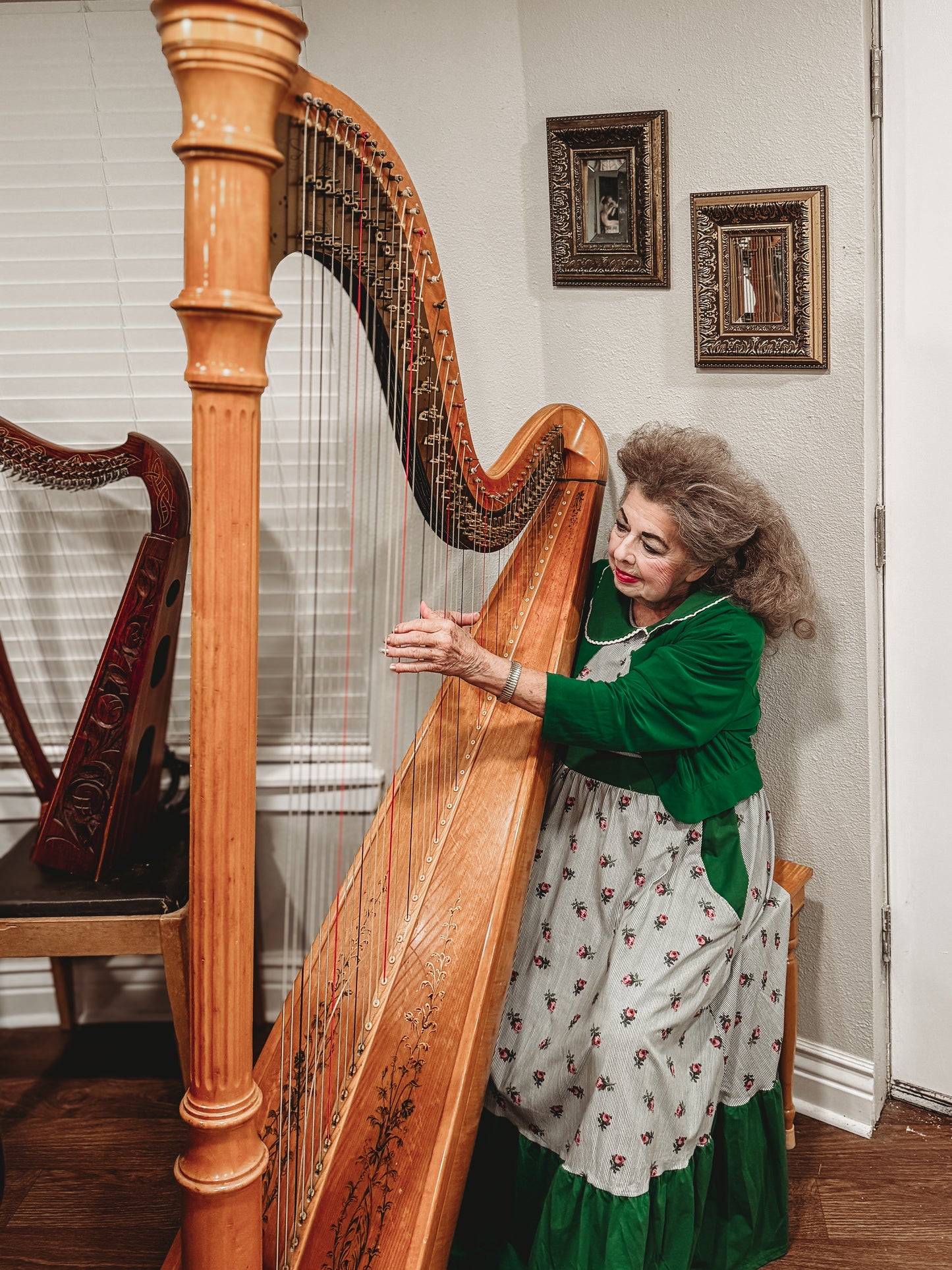 woman wearing a green and white striped modest nursing dress