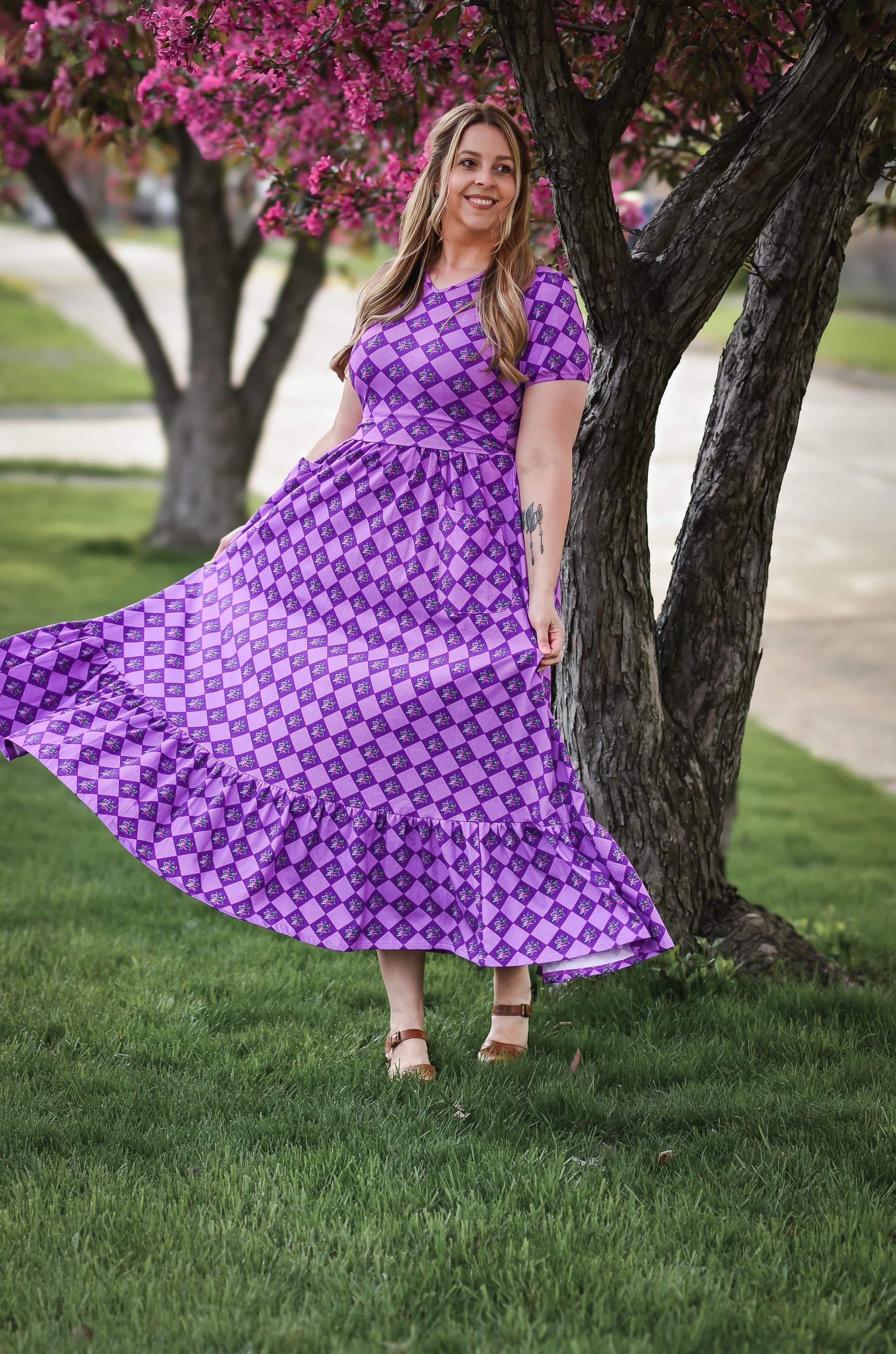 woman wearing patterned purple modest nursing dress
