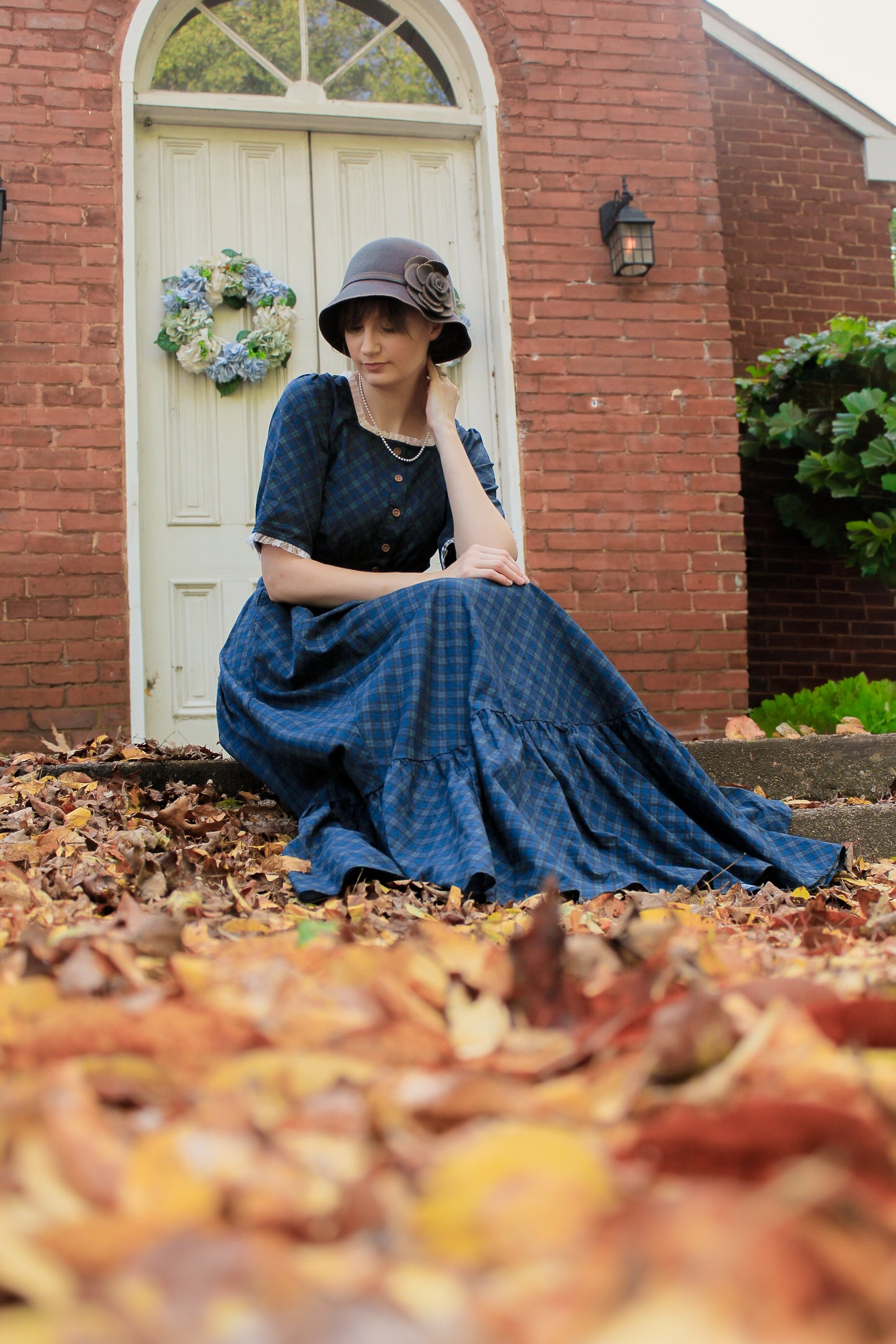 woman wearing a modest nursing blue patterned dress