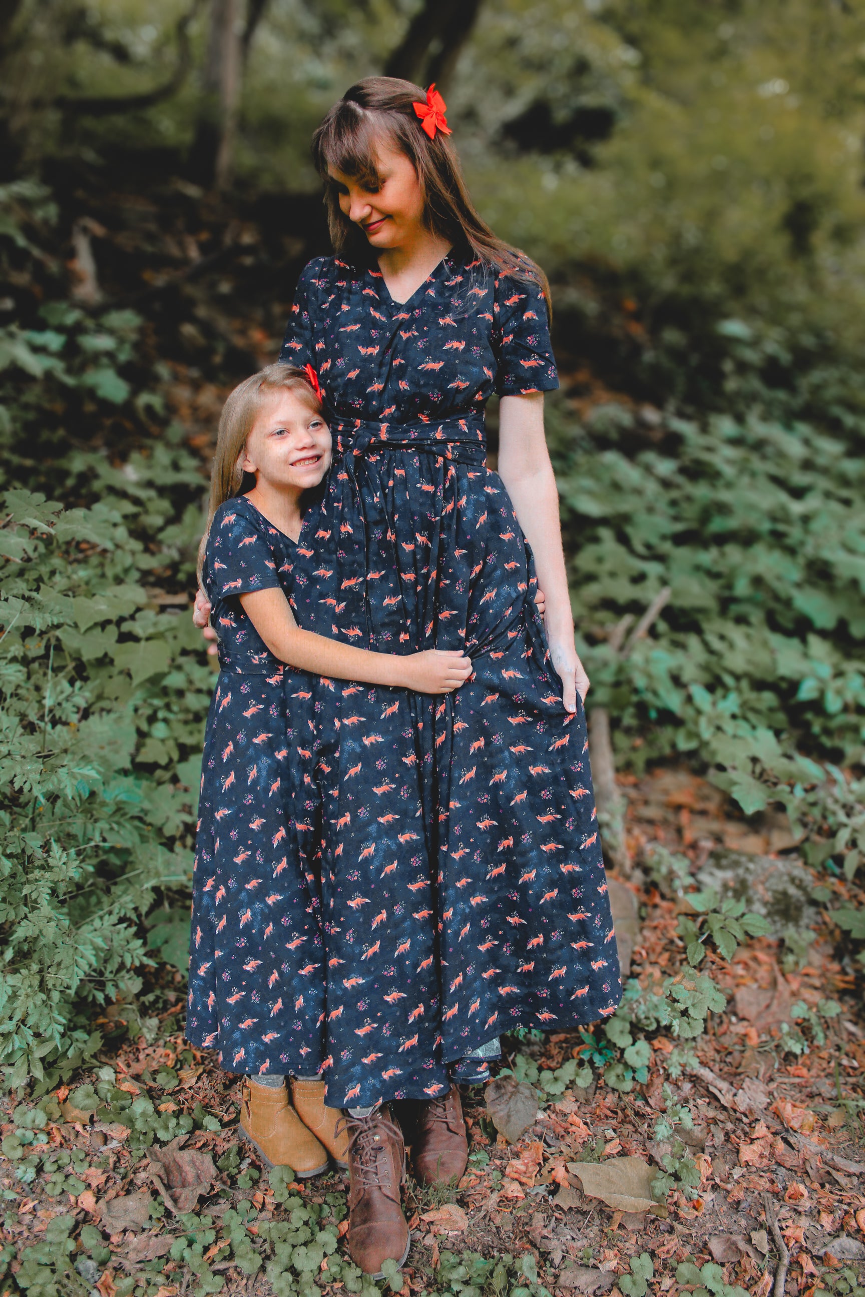 Two women in modest nursing dresses