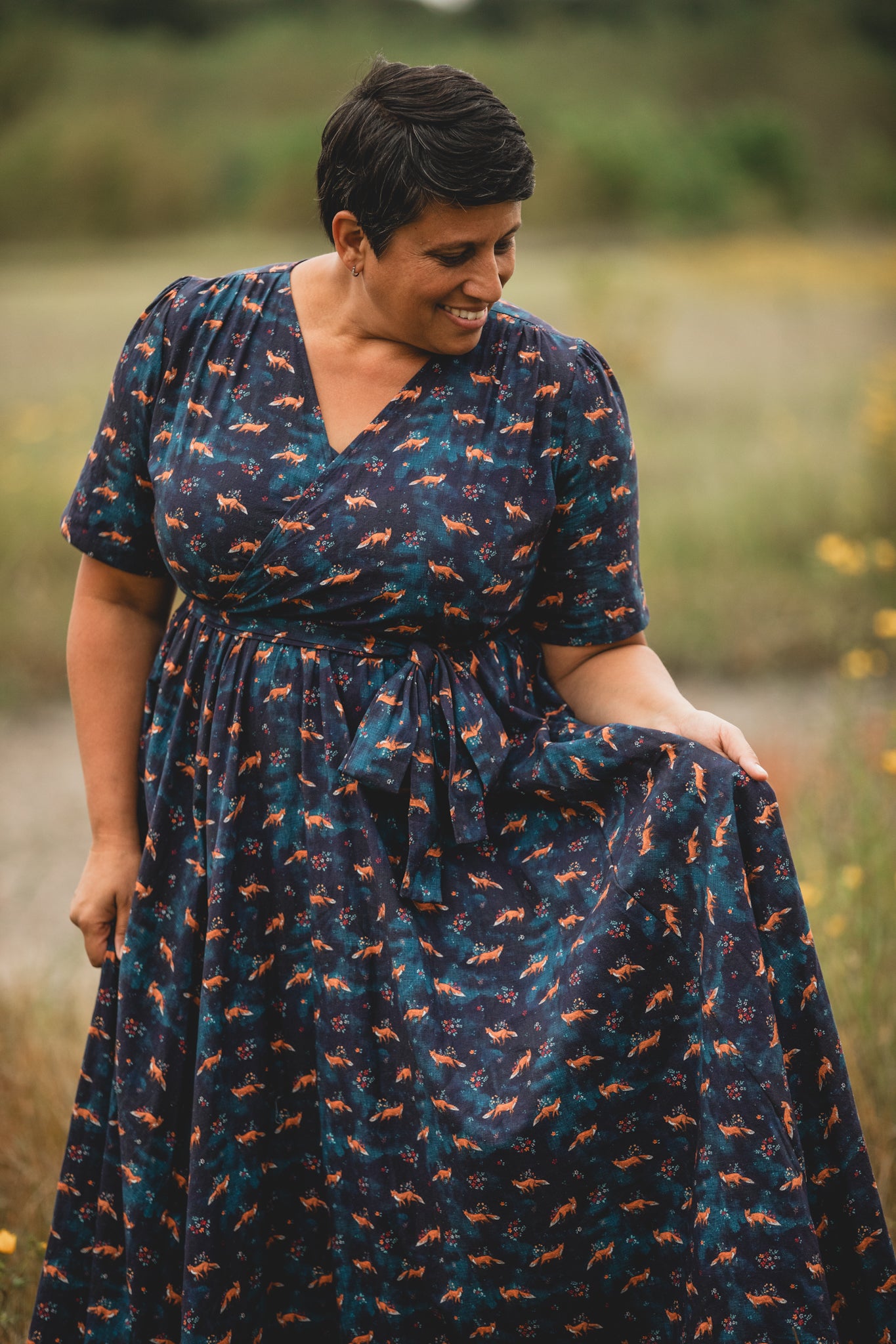 Woman in modest nursing dress in field
