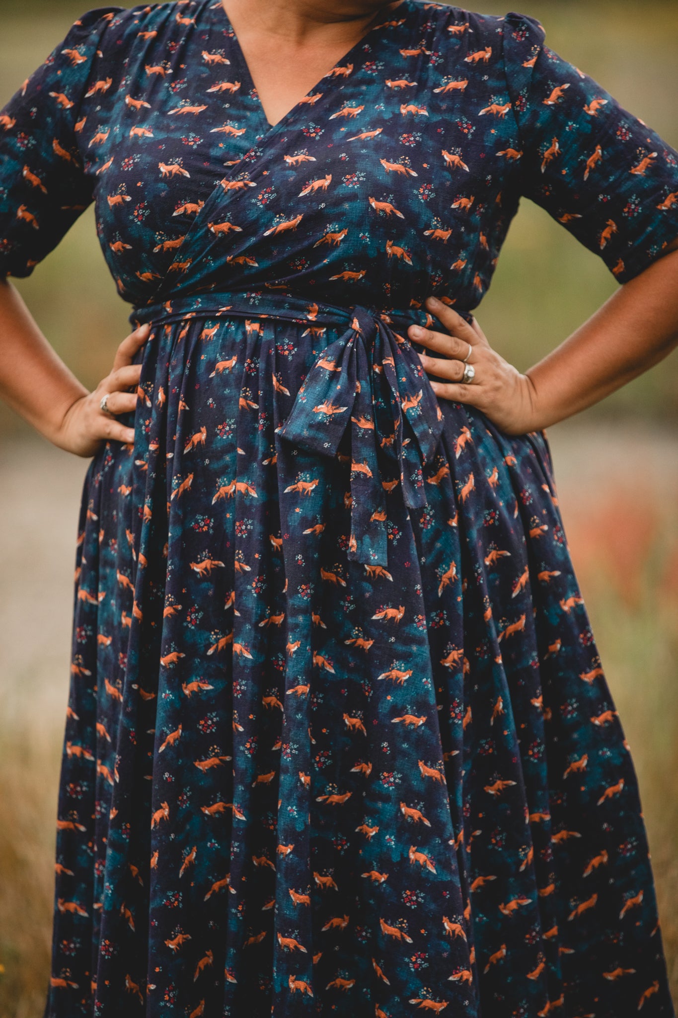 Woman in modest nursing dress with foxes