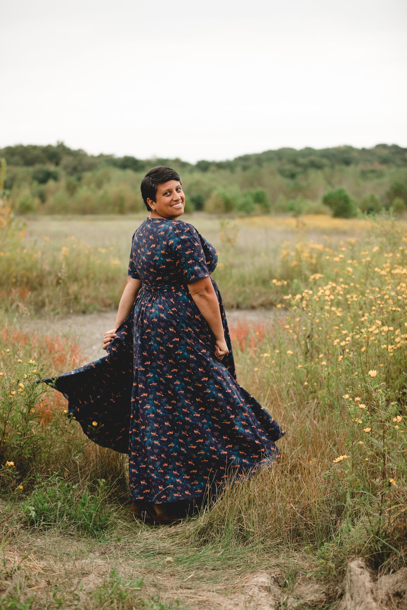 Woman in modest nursing dress with wildflowers