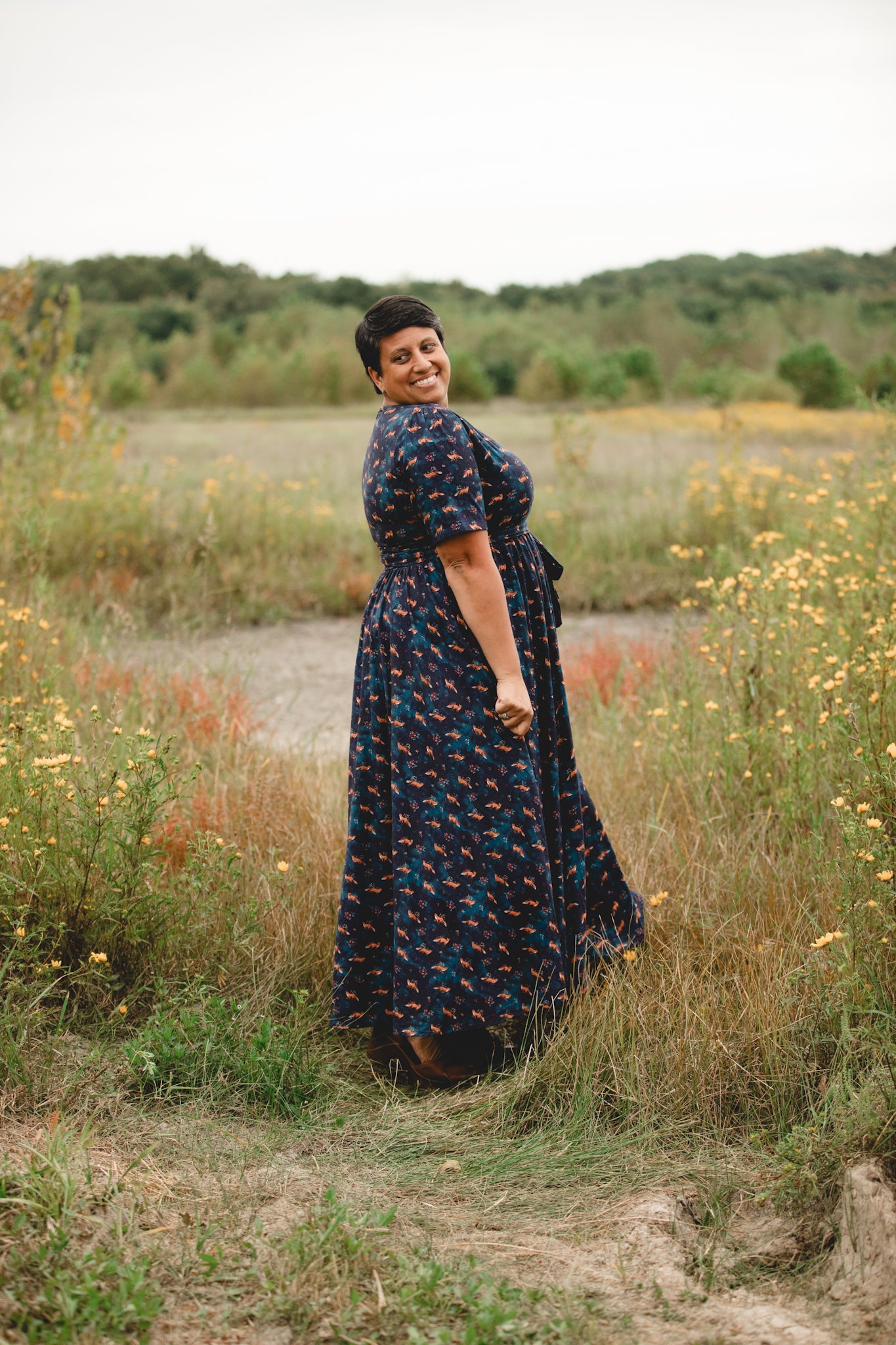 Woman in modest nursing dress, wildflowers