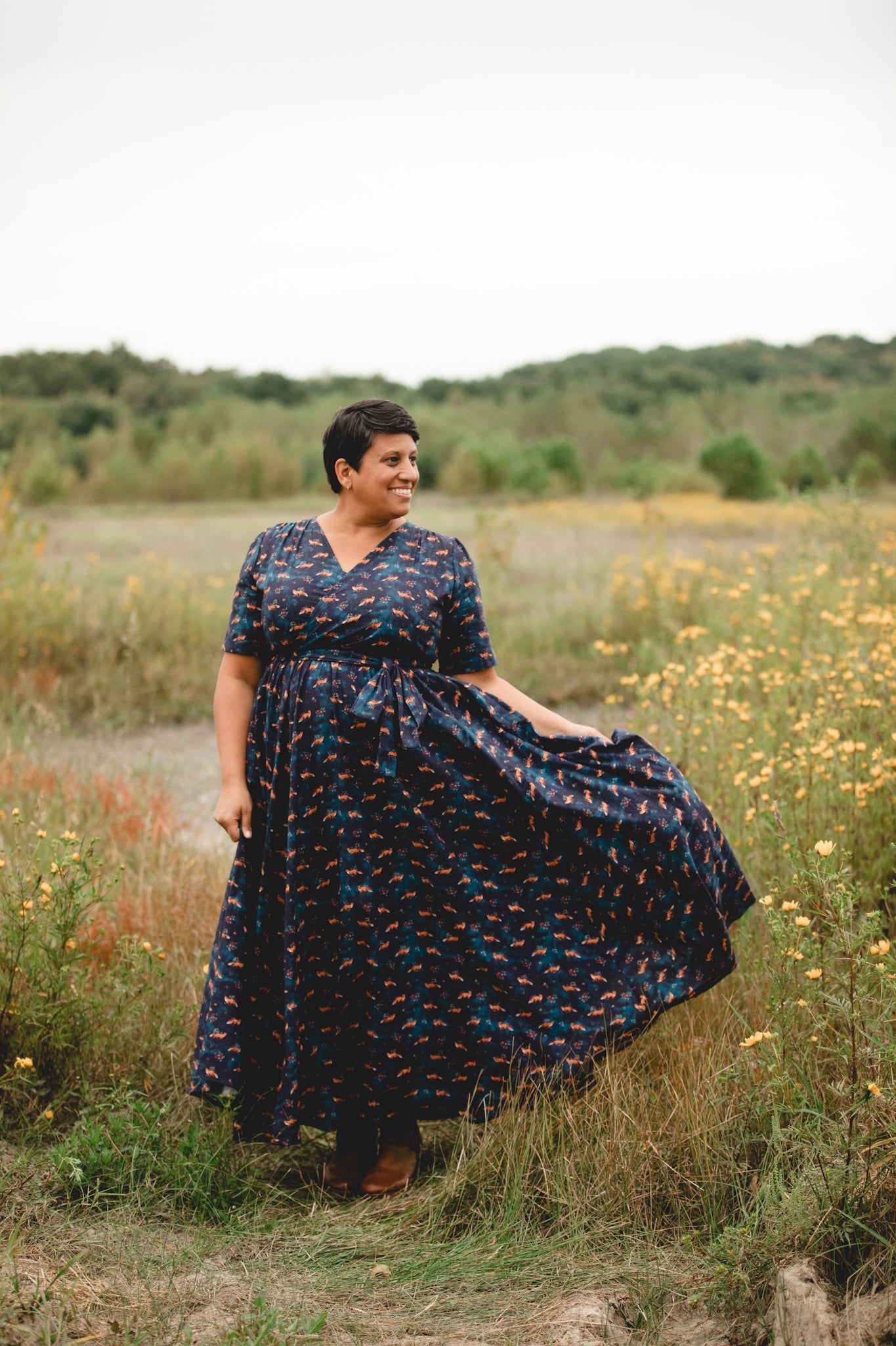 Woman in modest nursing dress in field