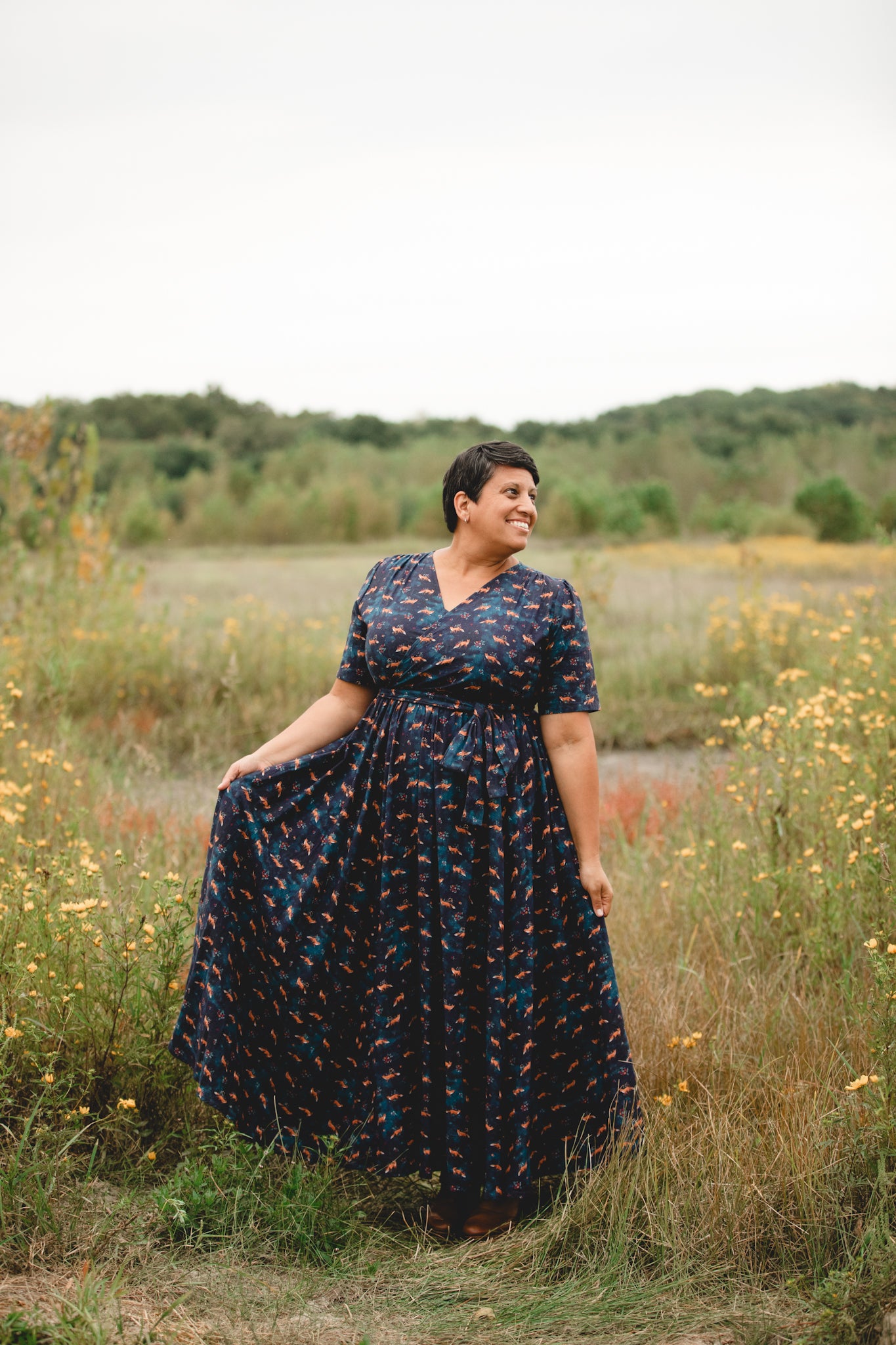 Woman in modest nursing dress, field wildflowers