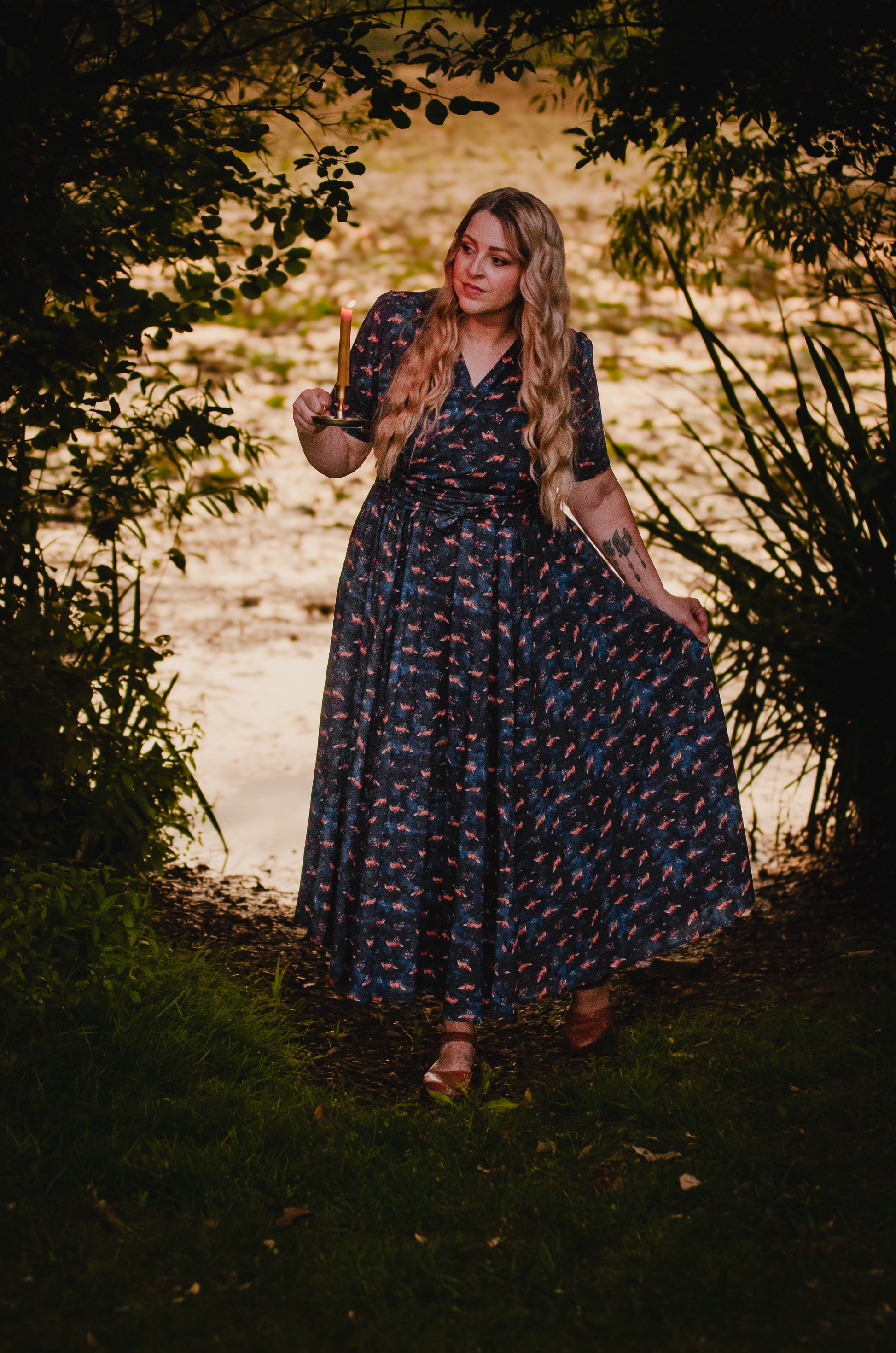 Woman in modest nursing dress by water