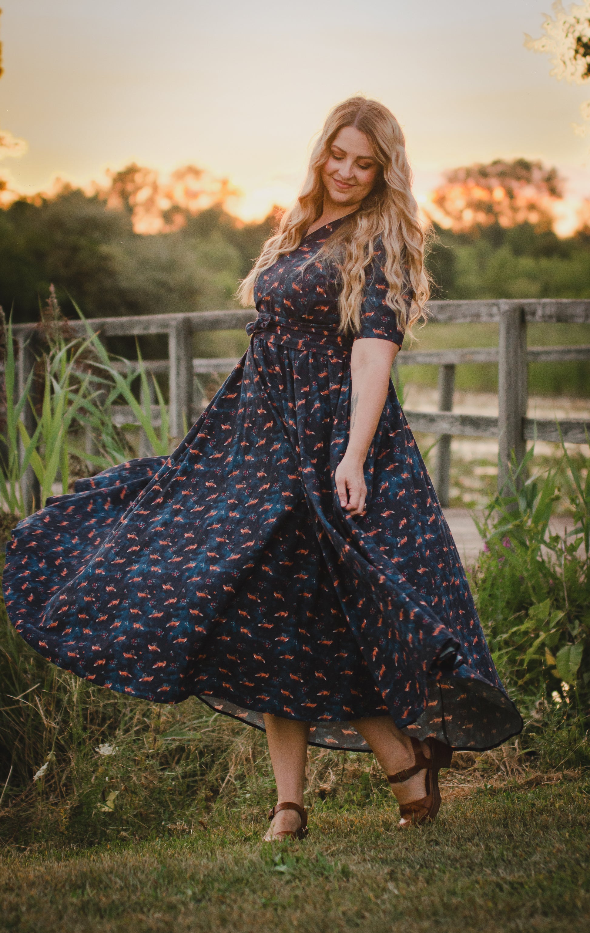 Woman in modest nursing dress at sunset