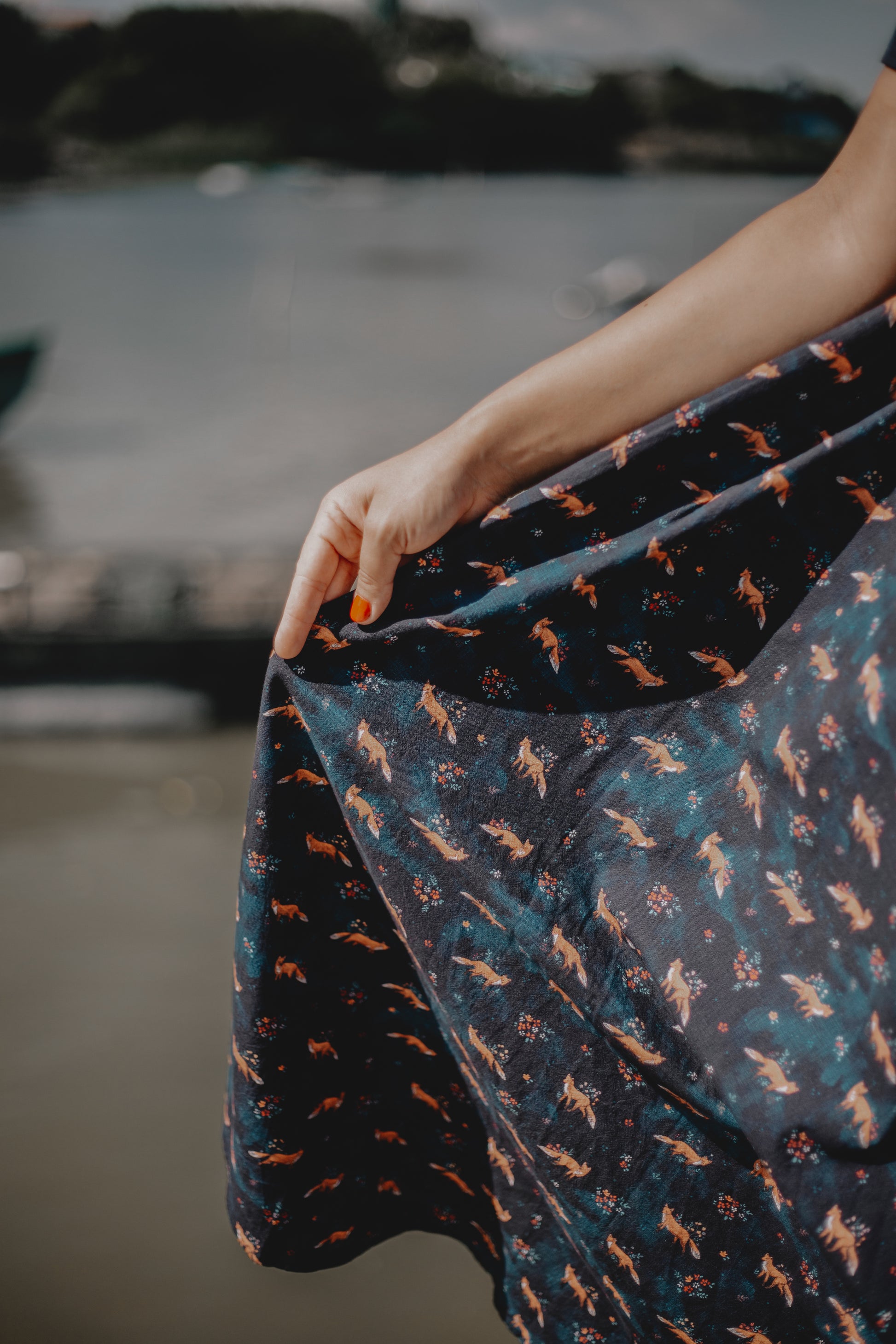 Woman in modest nursing dress holding fabric