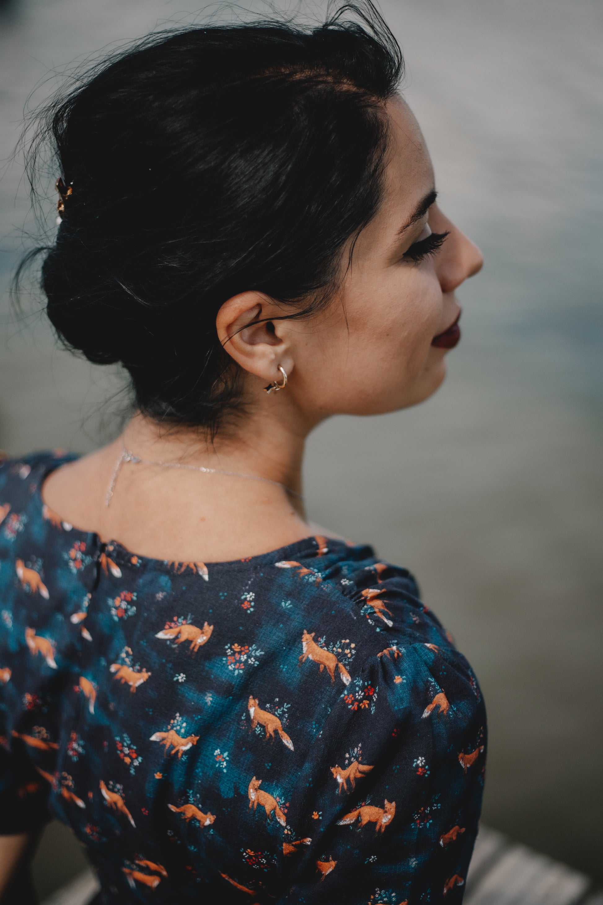Woman in modest nursing dress with foxes