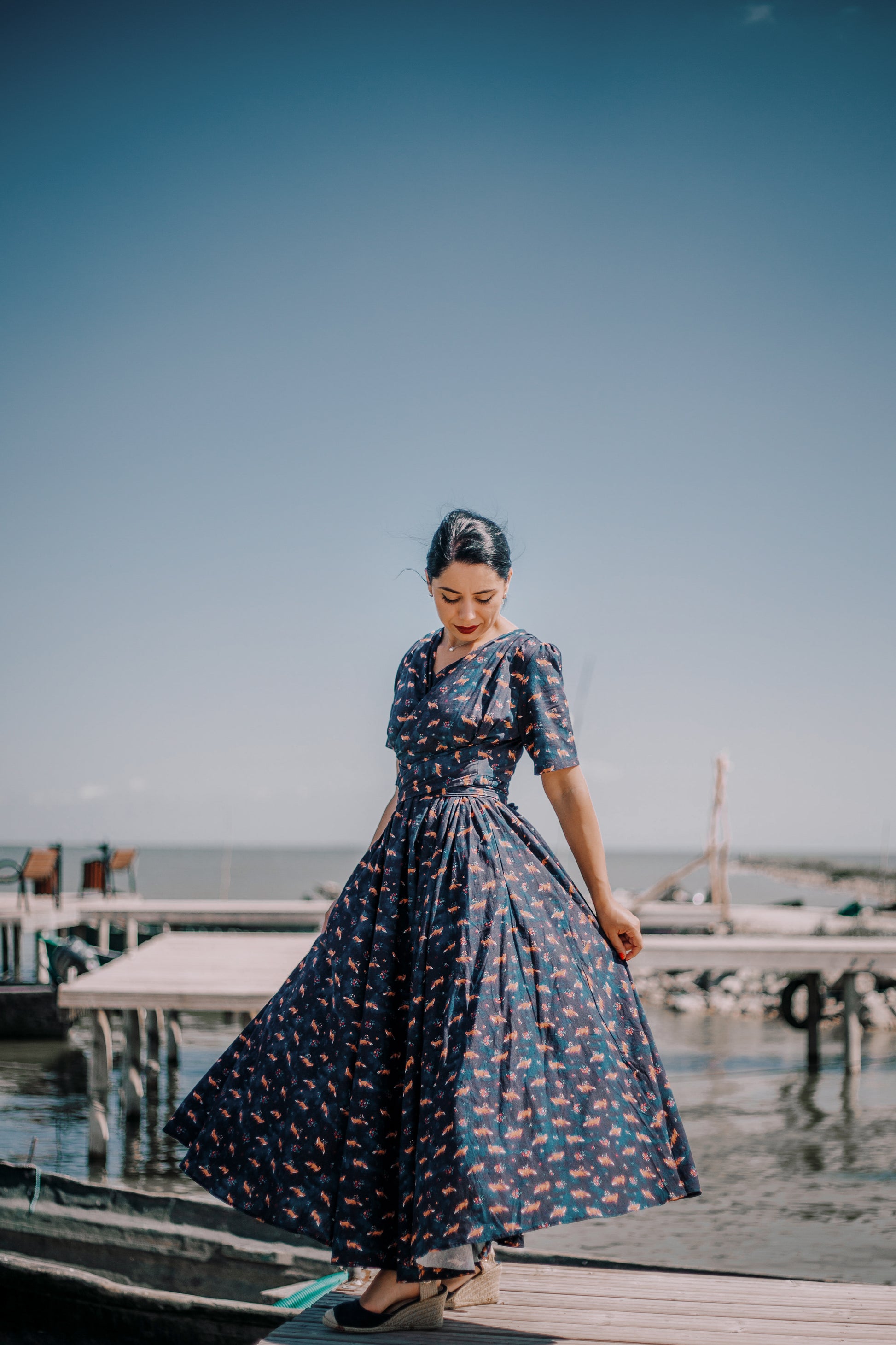 Woman in modest nursing dress on dock