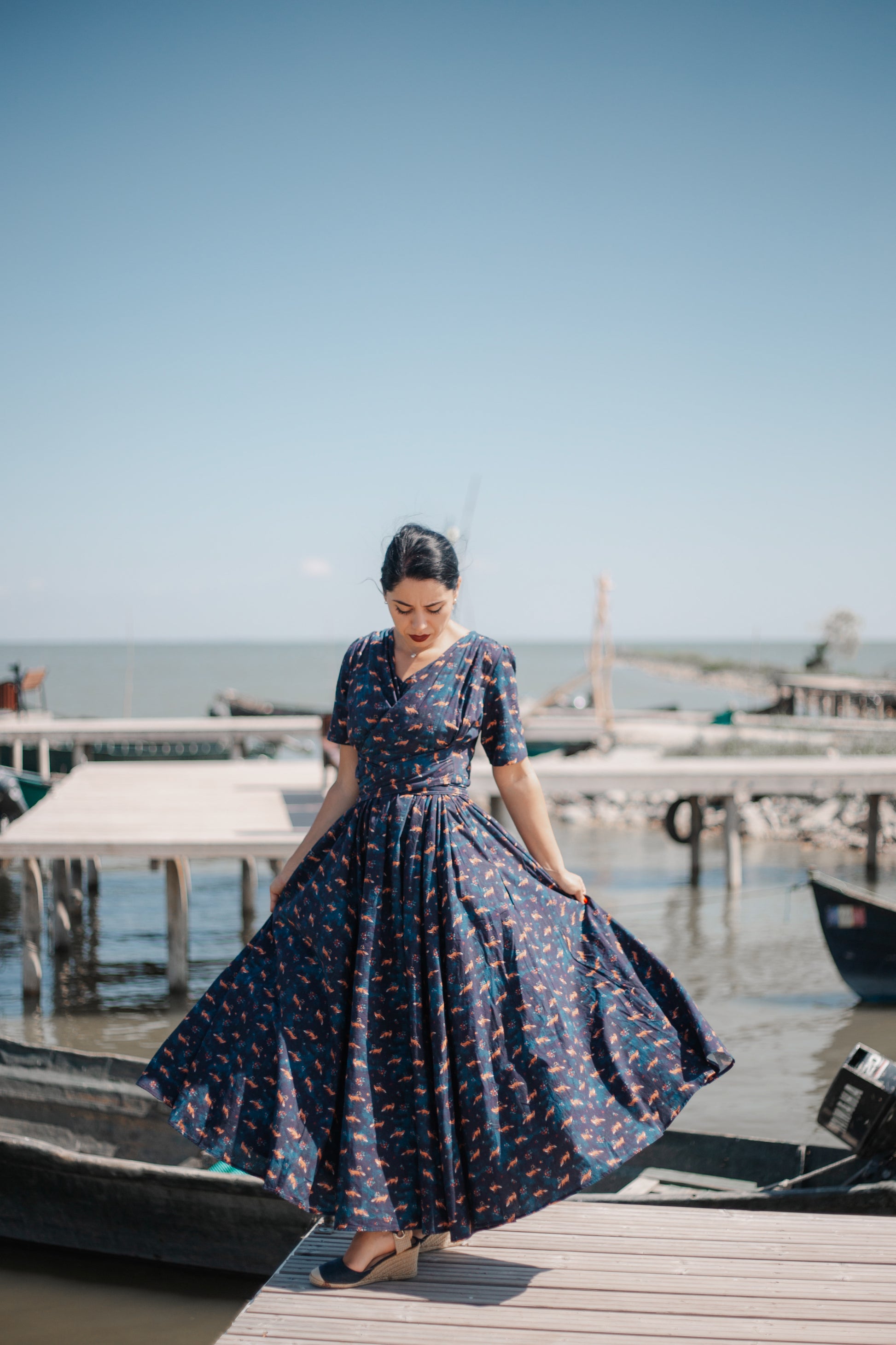 Woman in modest nursing dress on dock