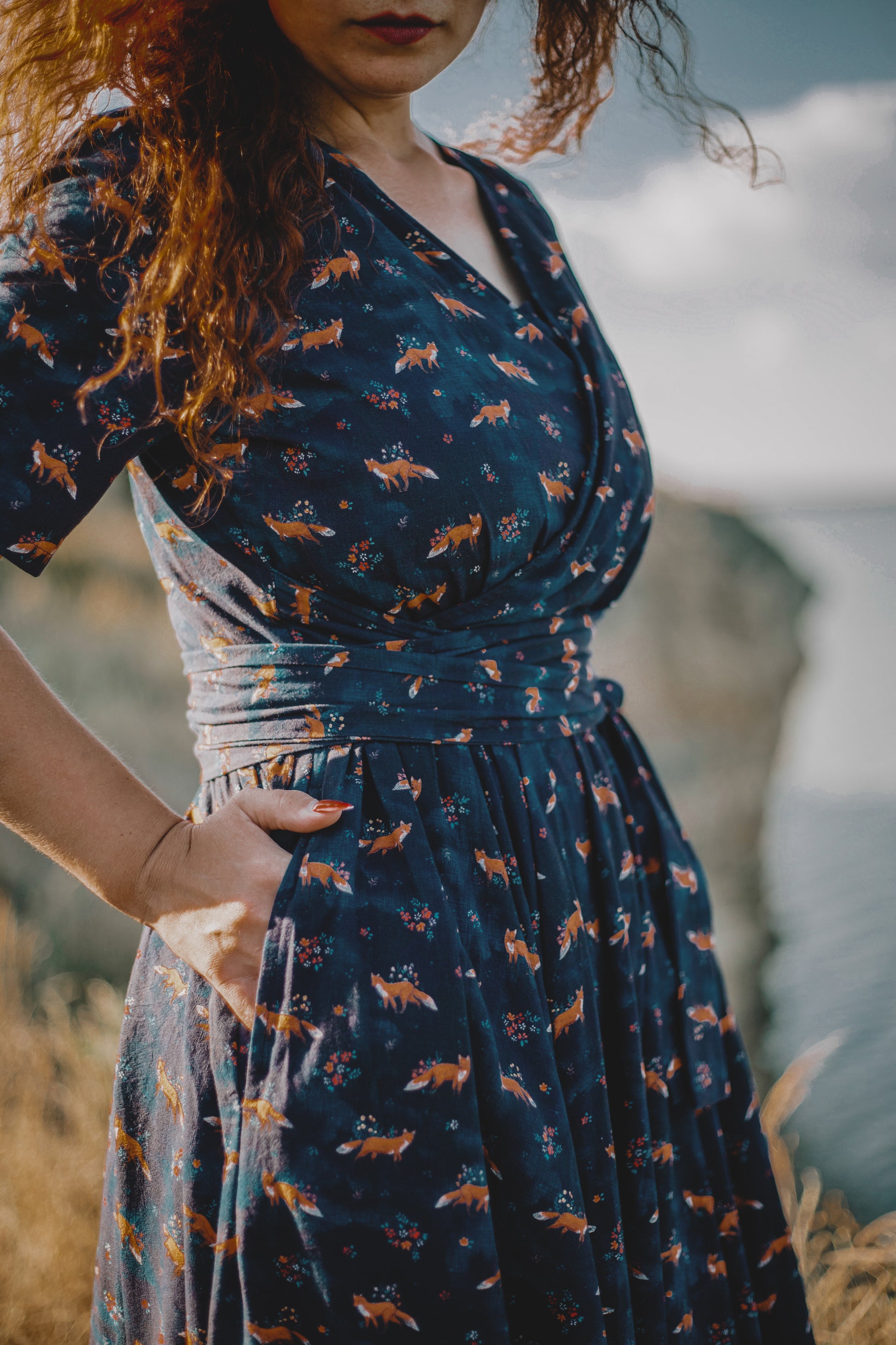 Woman in modest nursing dress, navy fox pattern