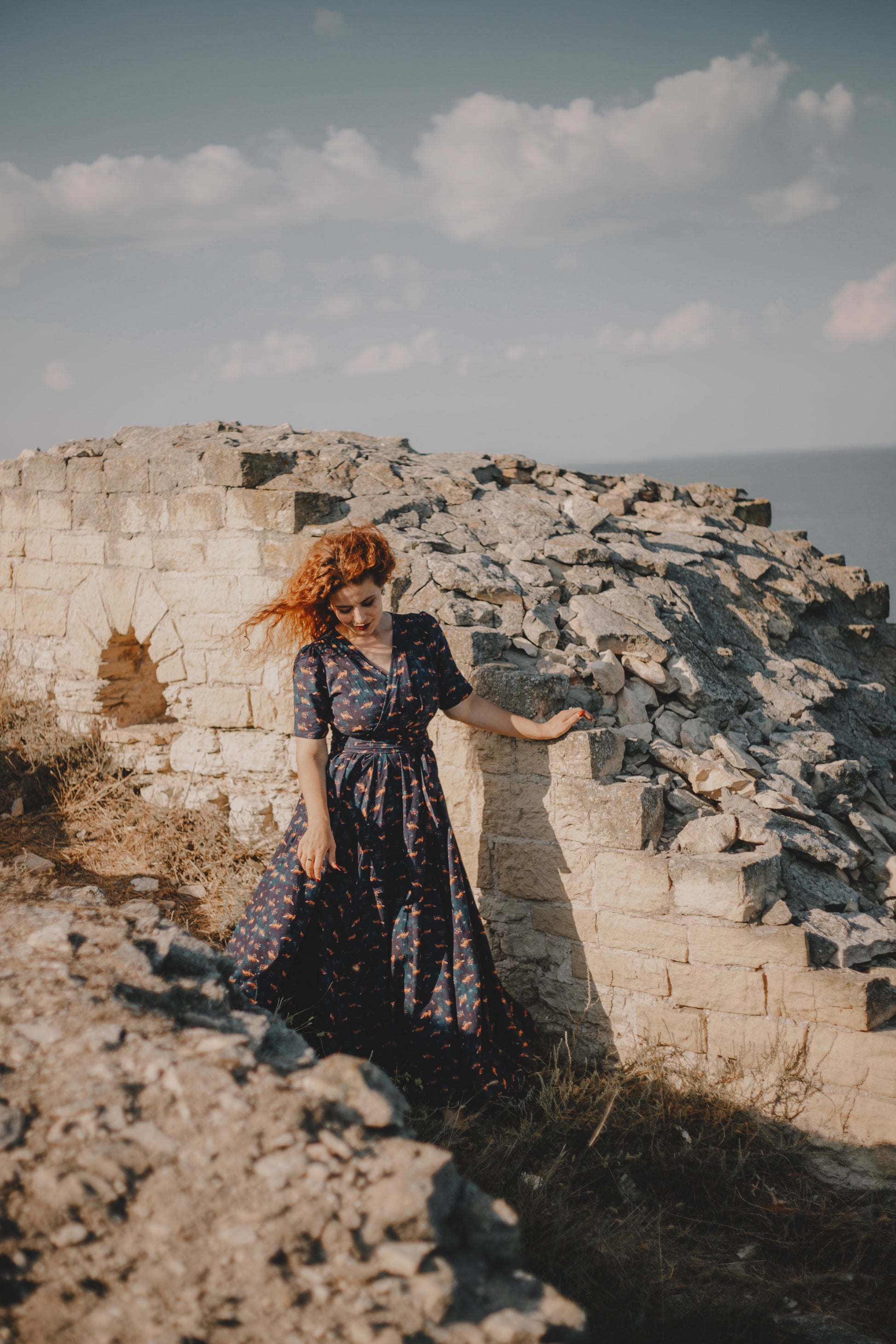 Woman in modest nursing dress on ruins
