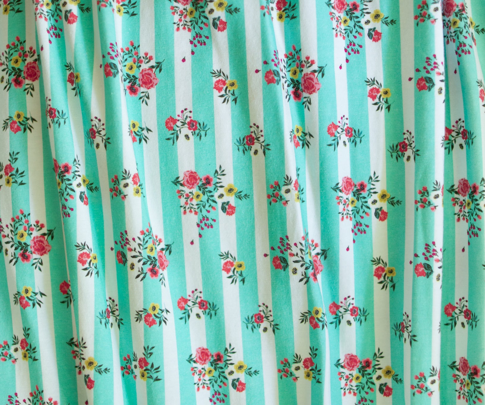 Fabric with floral pattern on a striped background