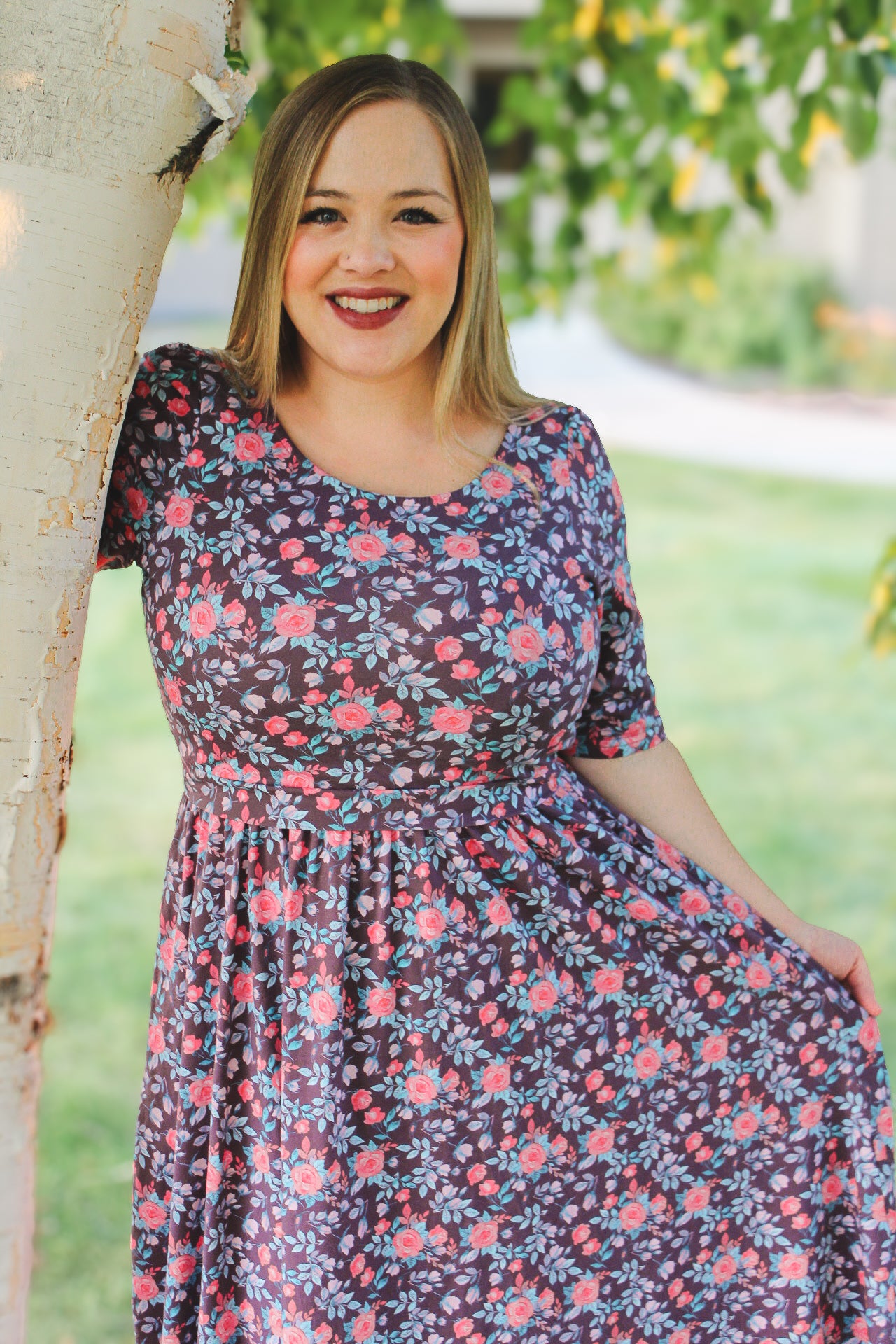woman wearing a modest nursing floral dress