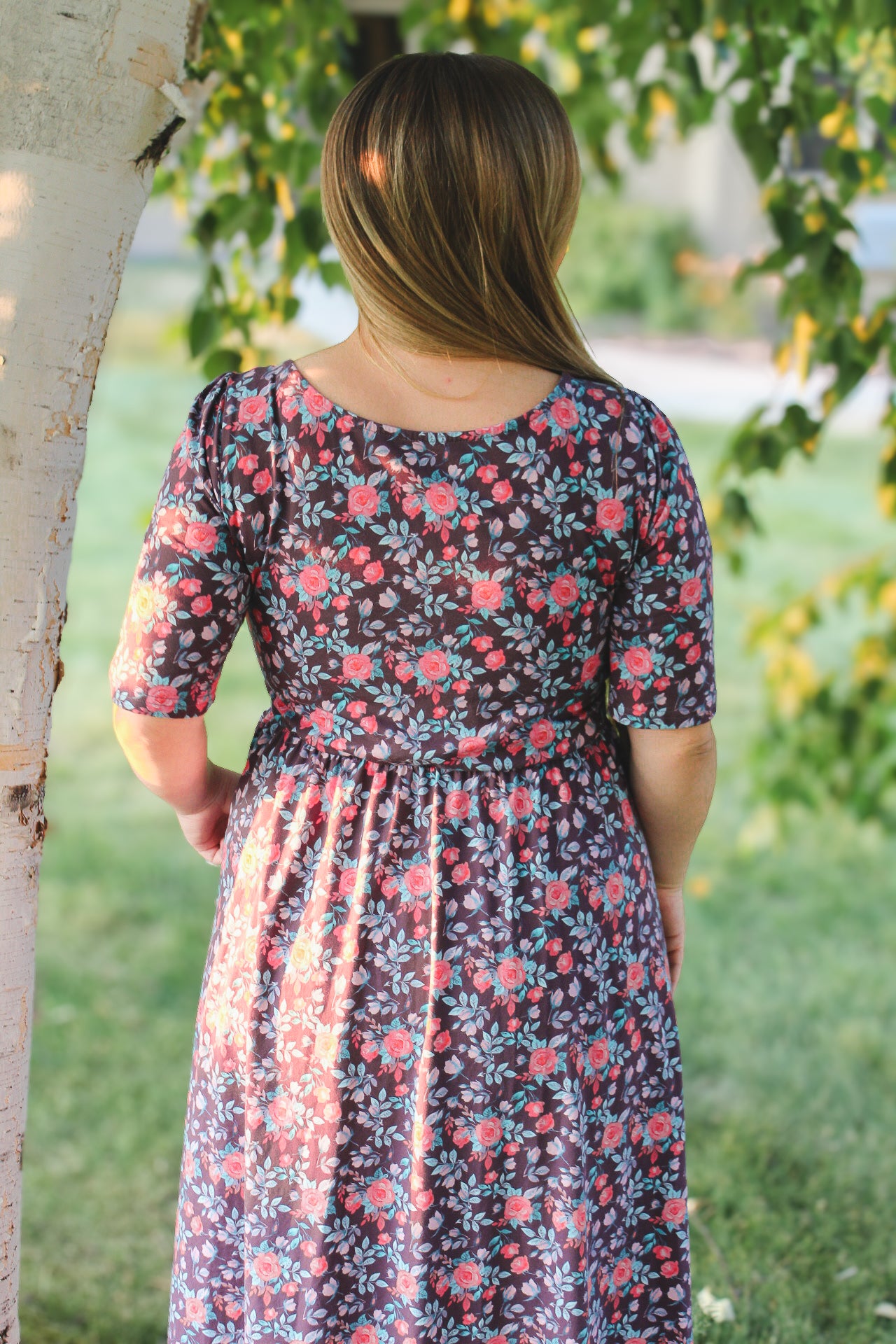 woman wearing a modest nursing floral dress