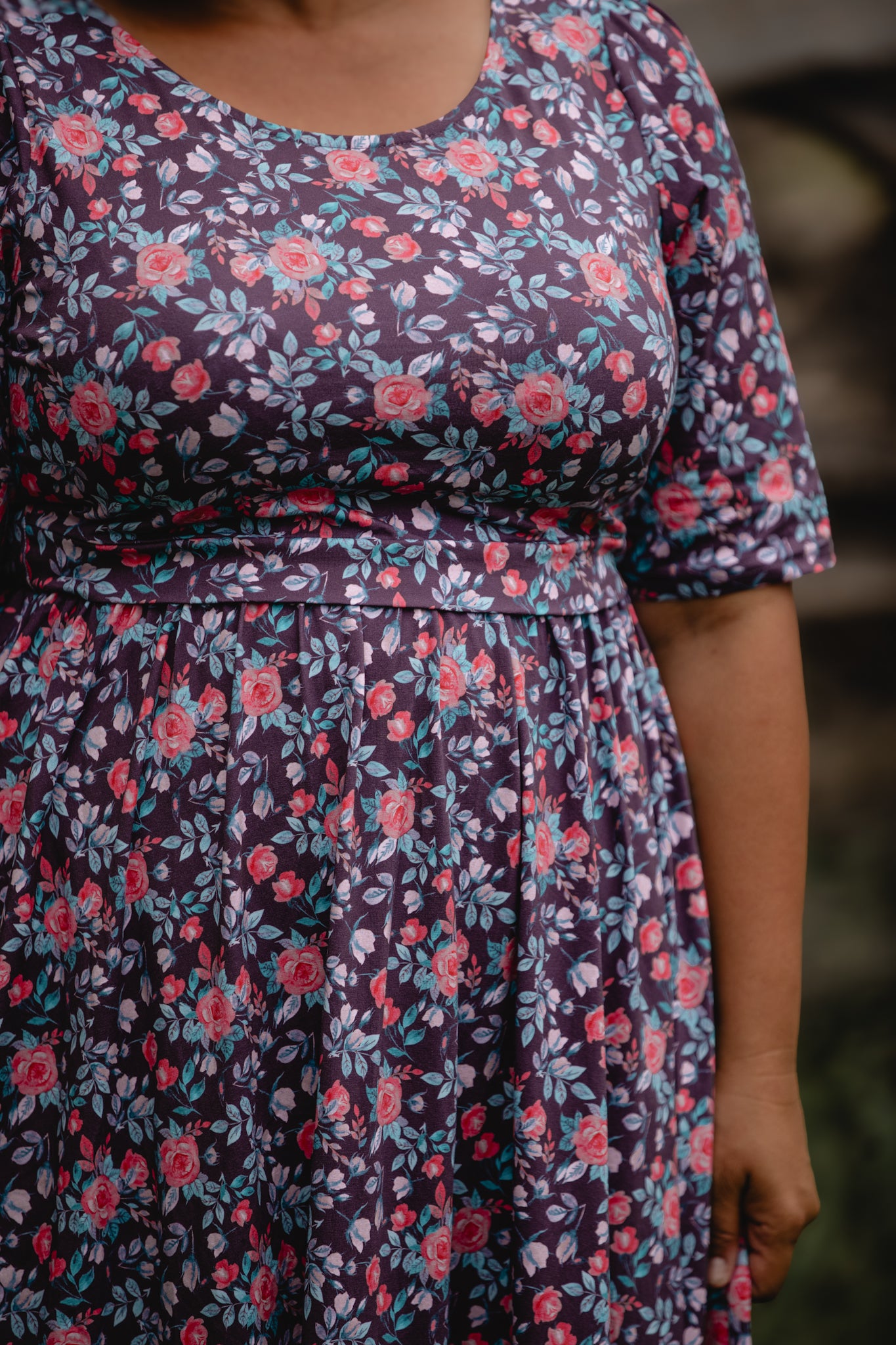 woman wearing a modest nursing floral dress