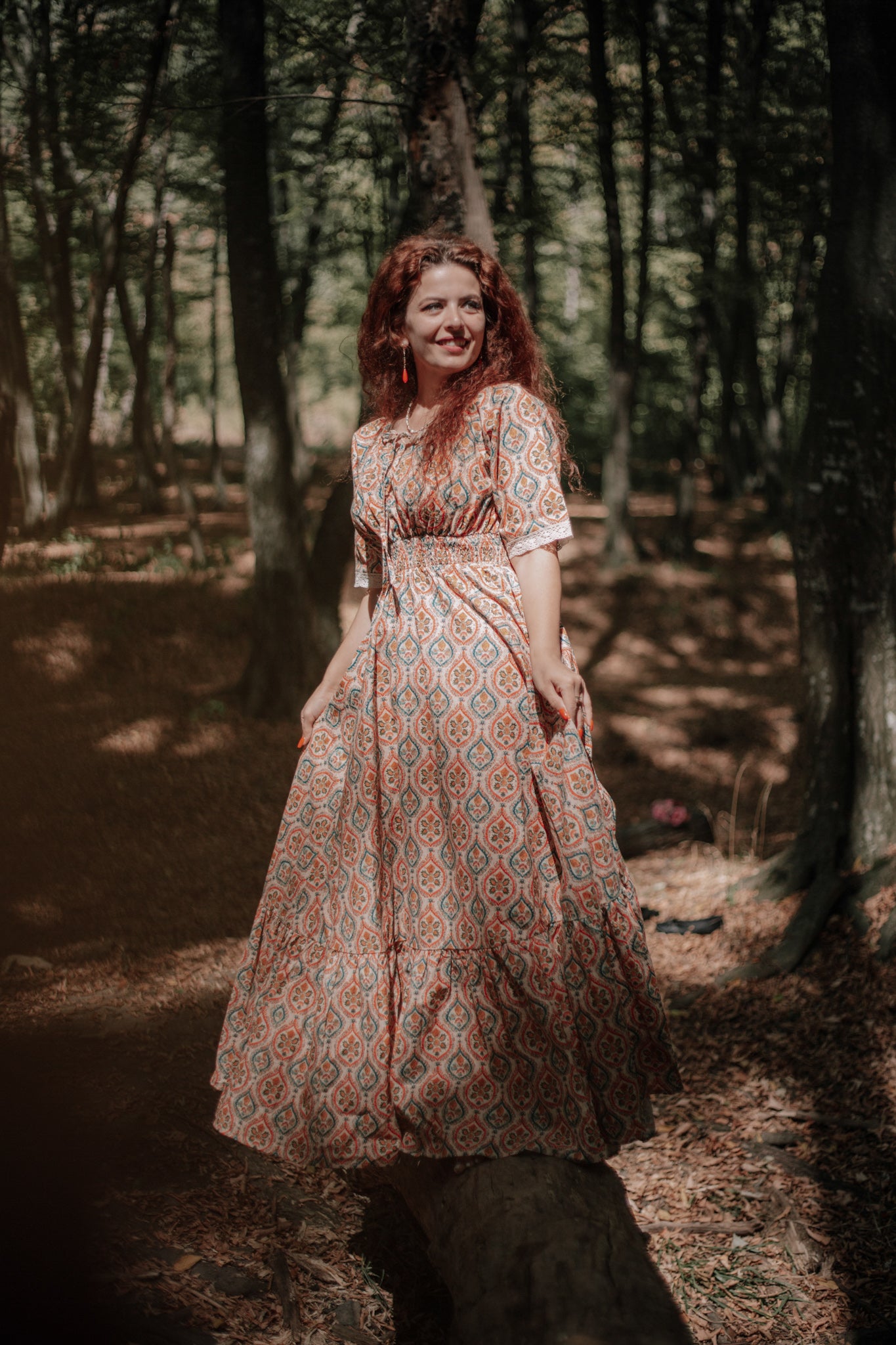 Woman wearing a patterned modest nursing dress