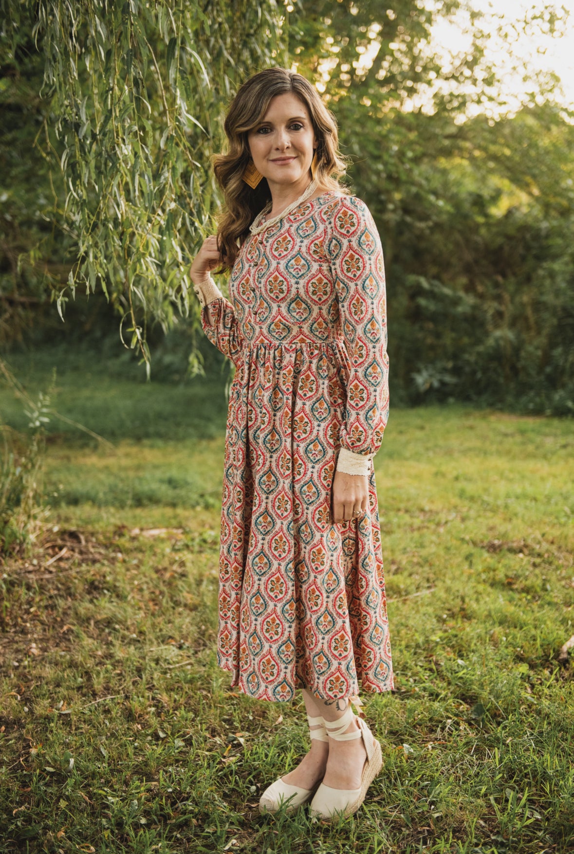 Woman wearing a patterned modest nursing dress