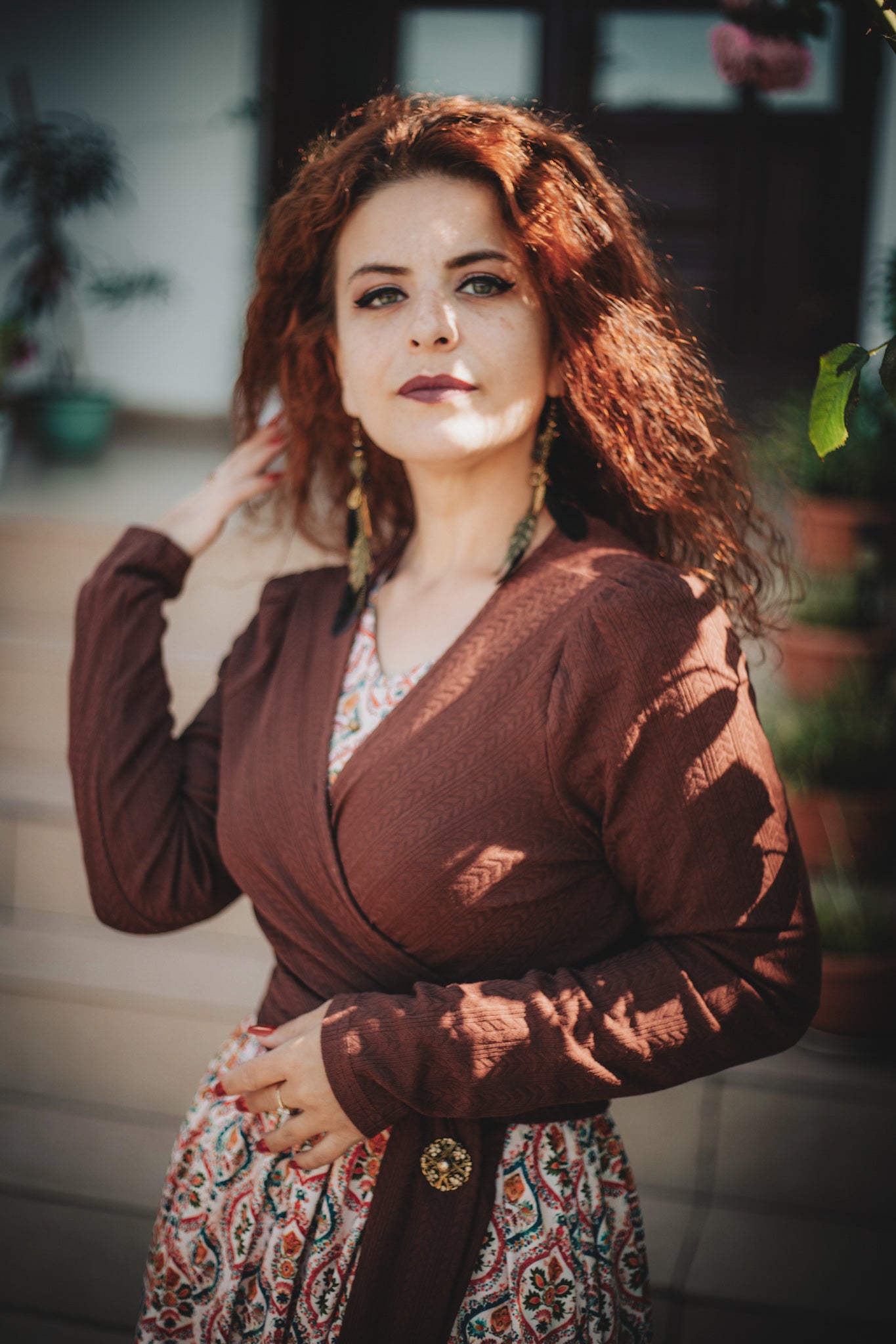Woman wearing a patterned modest nursing dress