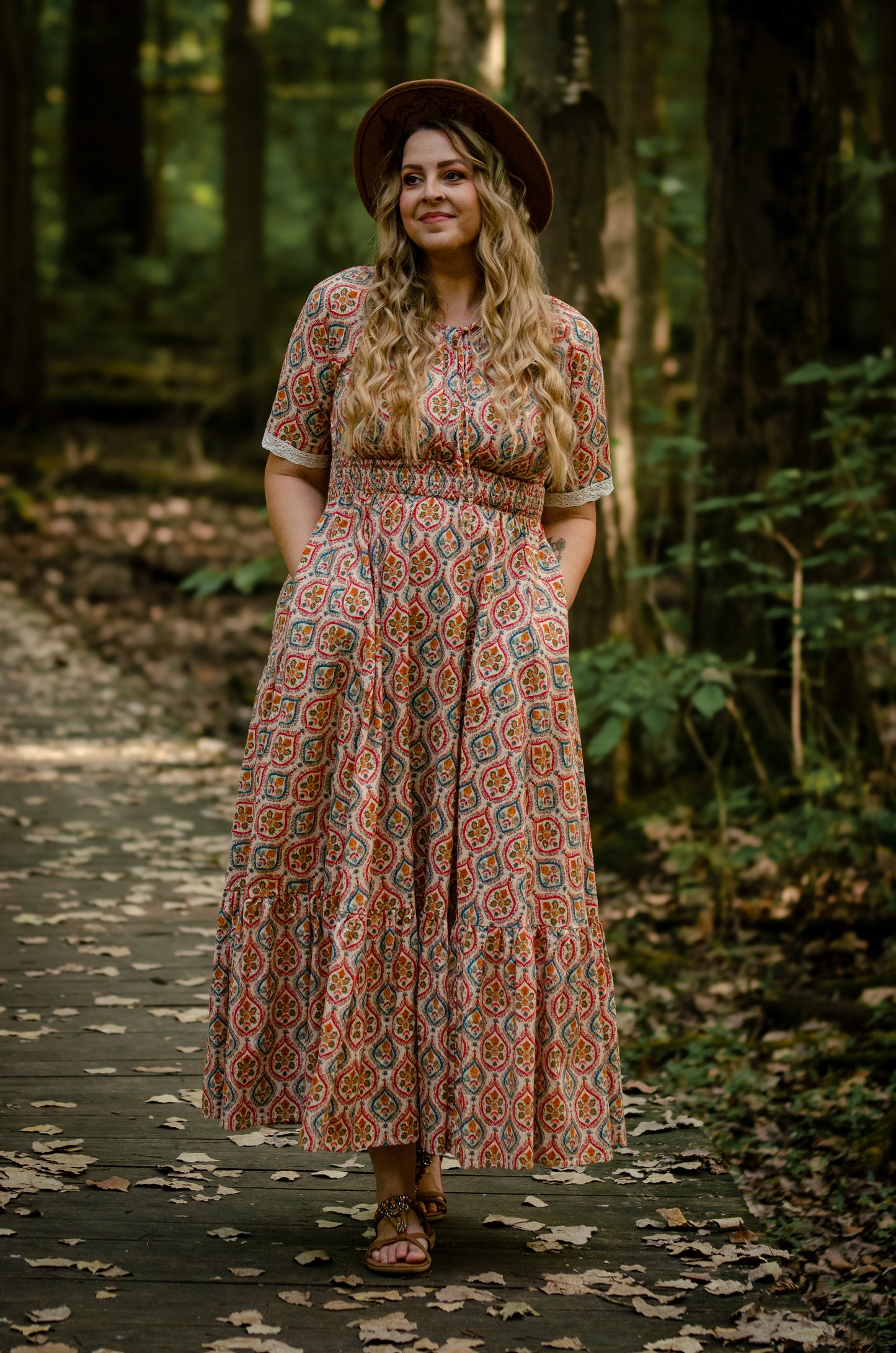 Woman wearing a patterned modest nursing dress